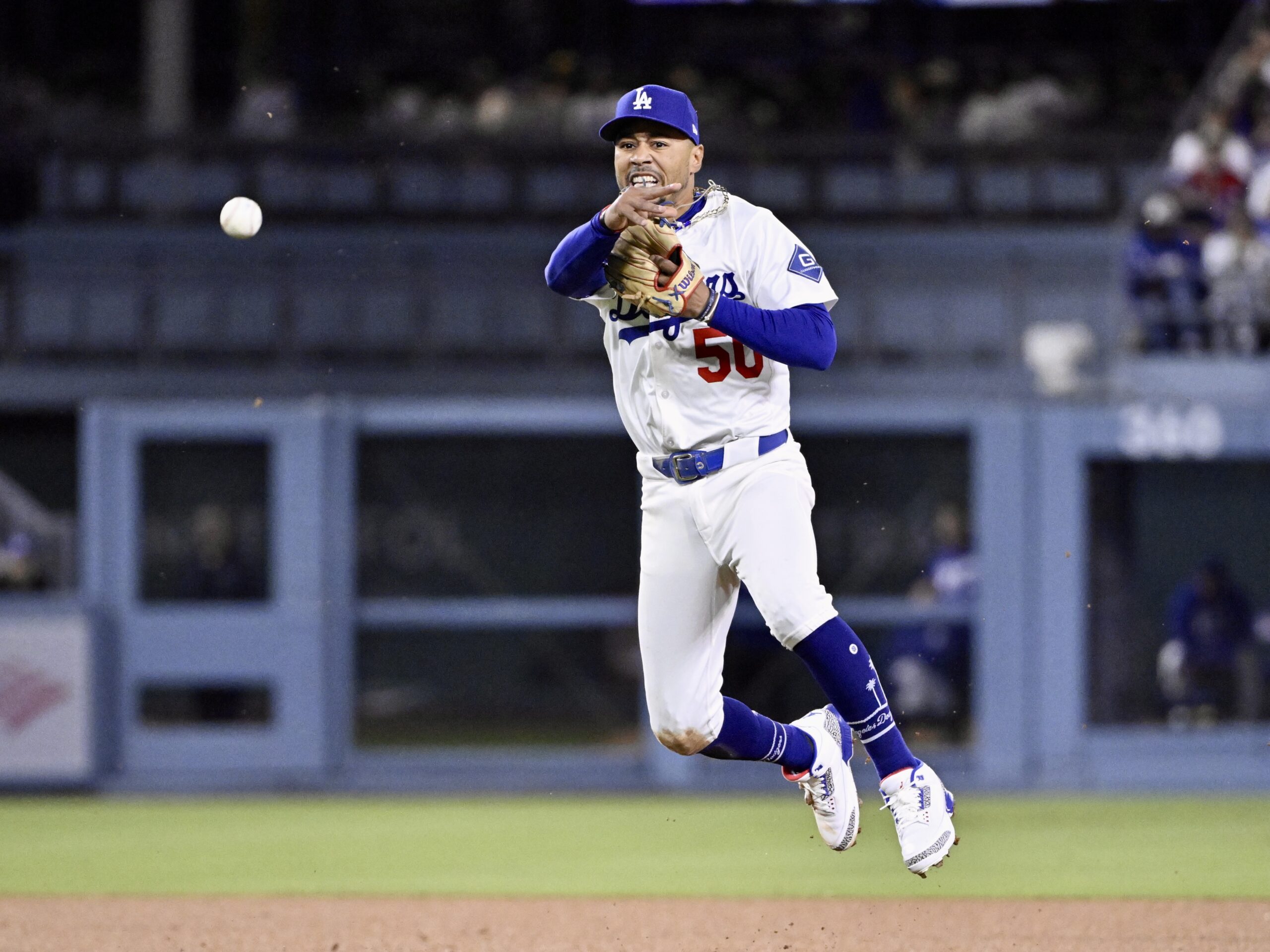 Dodgers shortstop Mookie Betts throws out the Philadelphia Phillies’ Trea...