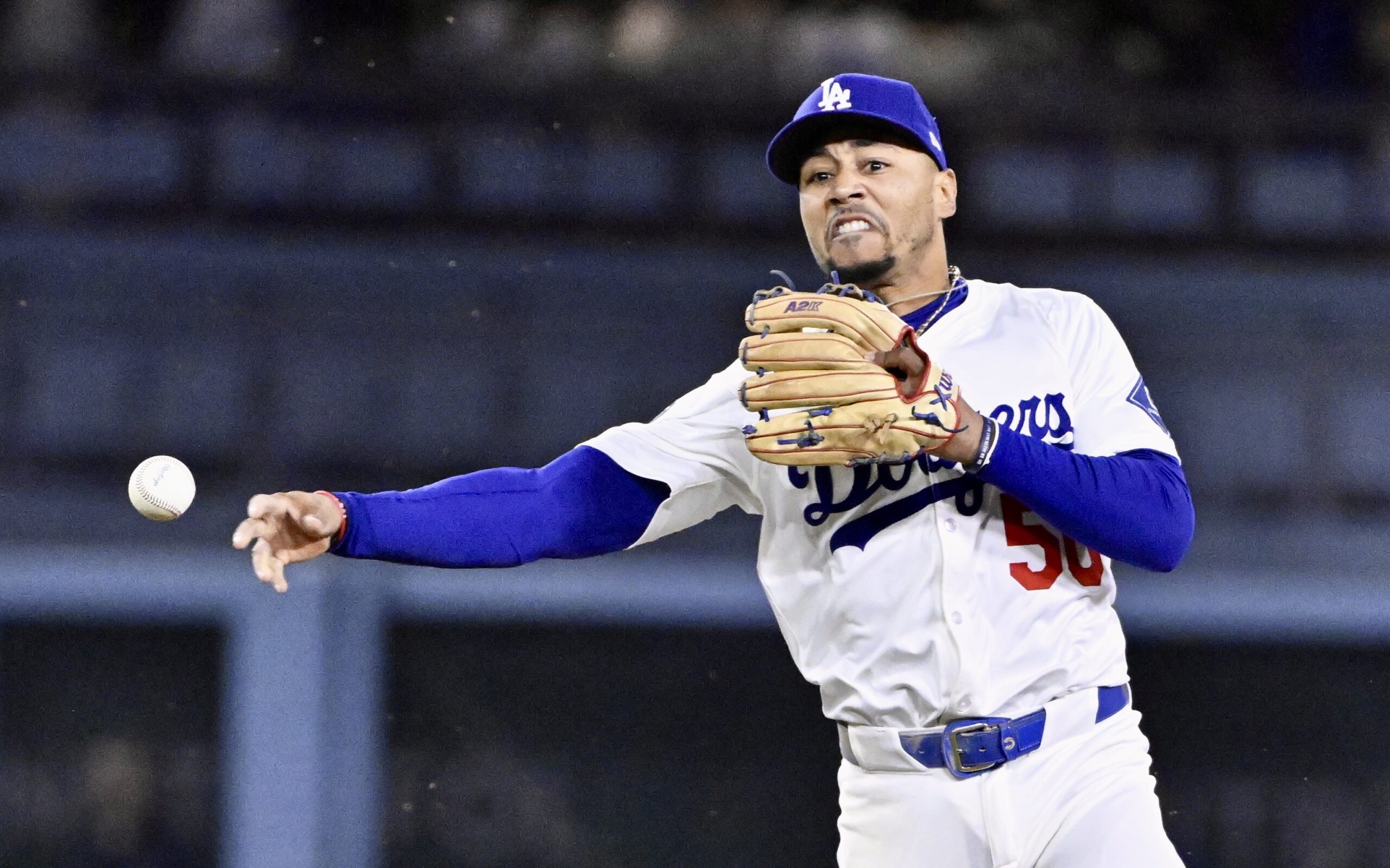 Dodgers shortstop Mookie Betts throws out the Philadelphia Phillies’ Trea...