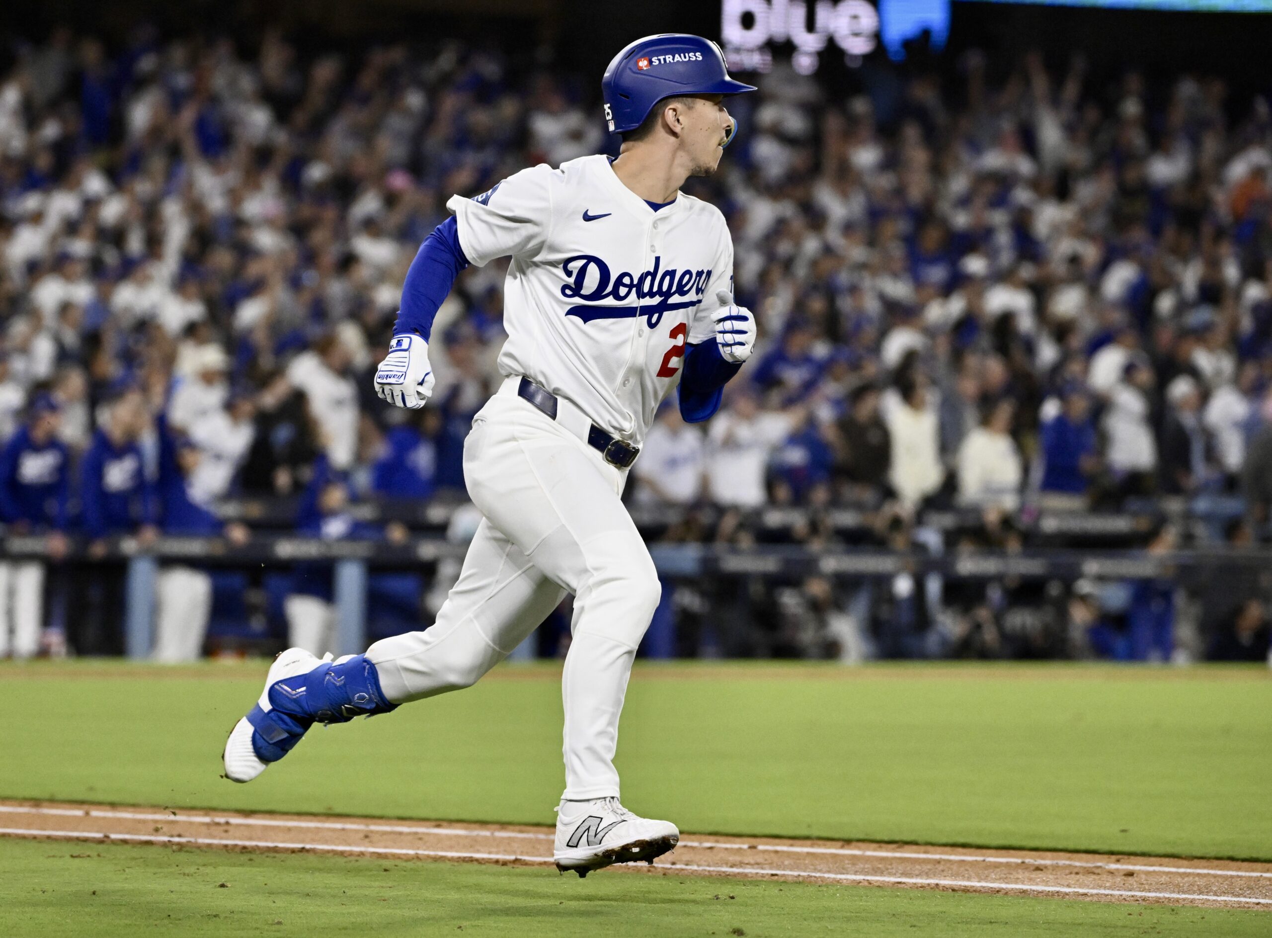 The Dodgers’ Tommy Edman runs the bases after hitting a...