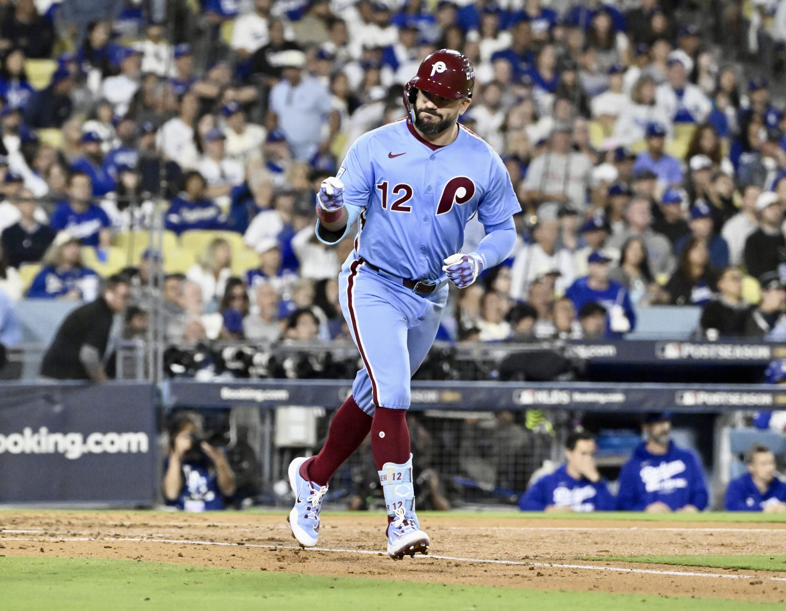 Philadelphia Phillies slugger Kyle Schwarber gestures to his dugout after...
