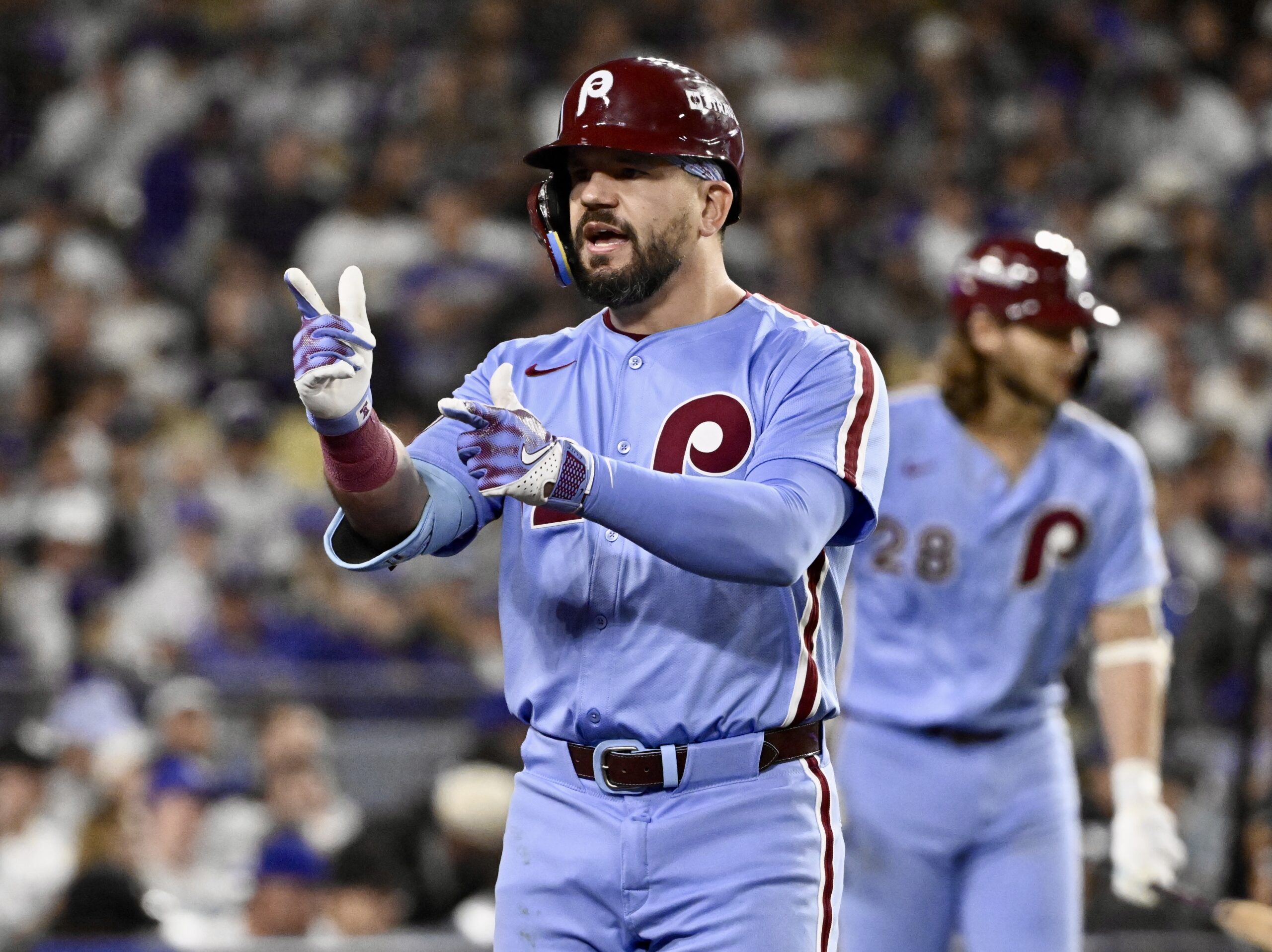Philadelphia Phillies slugger Kyle Schwarber celebrates after hitting a titanic...