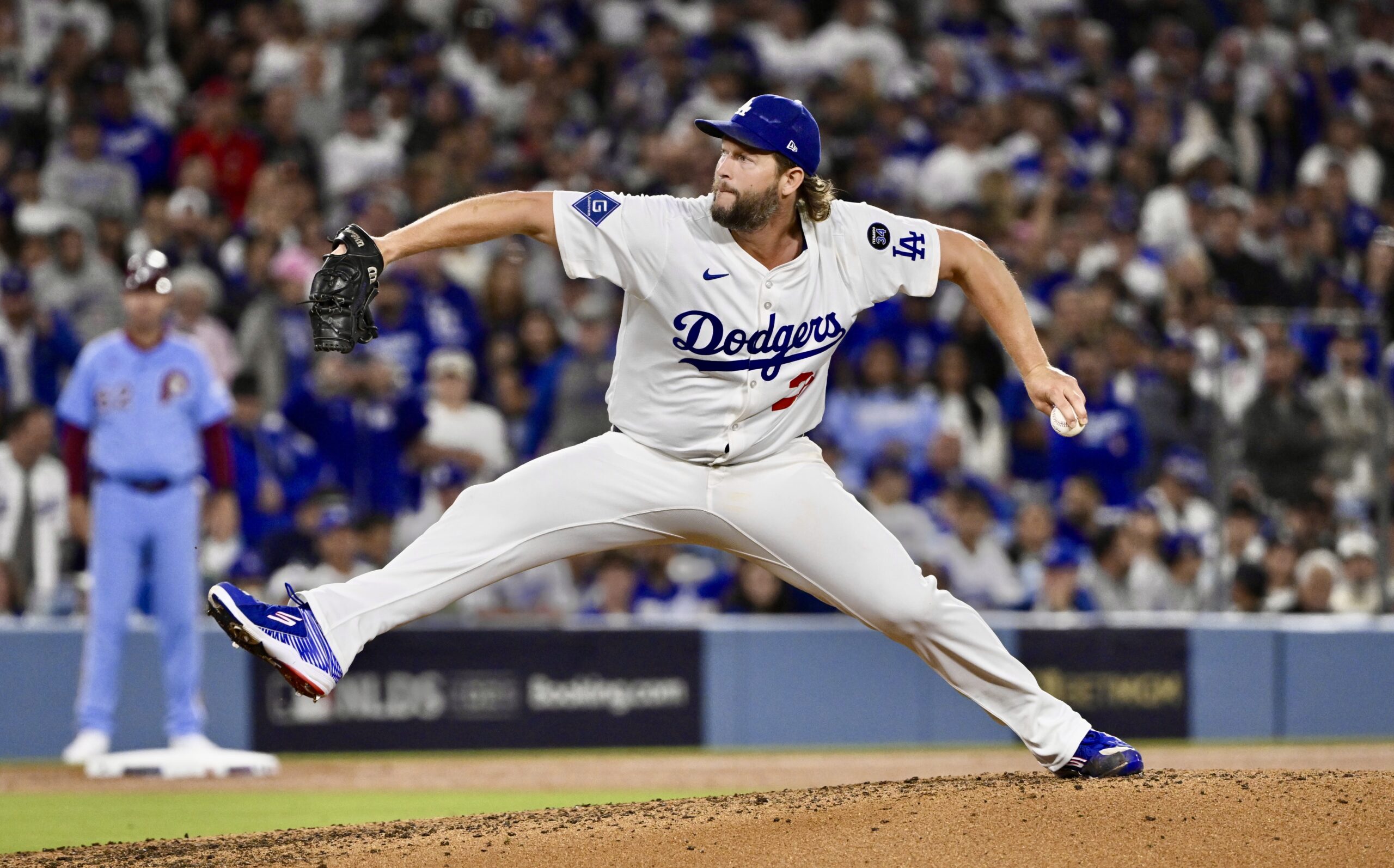 Dodgers relief pitcher Clayton Kershaw throws to the plate during...
