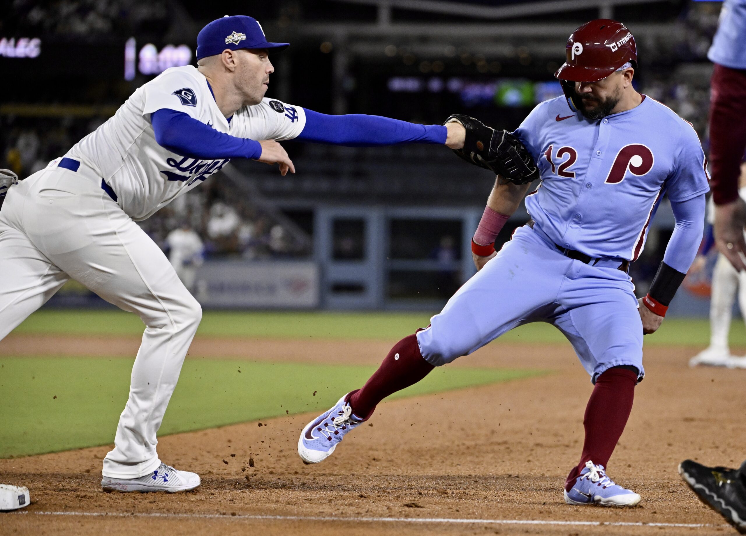 Dodgers first baseman Freddie Freeman tags out Philadelphia Phillies slugger...
