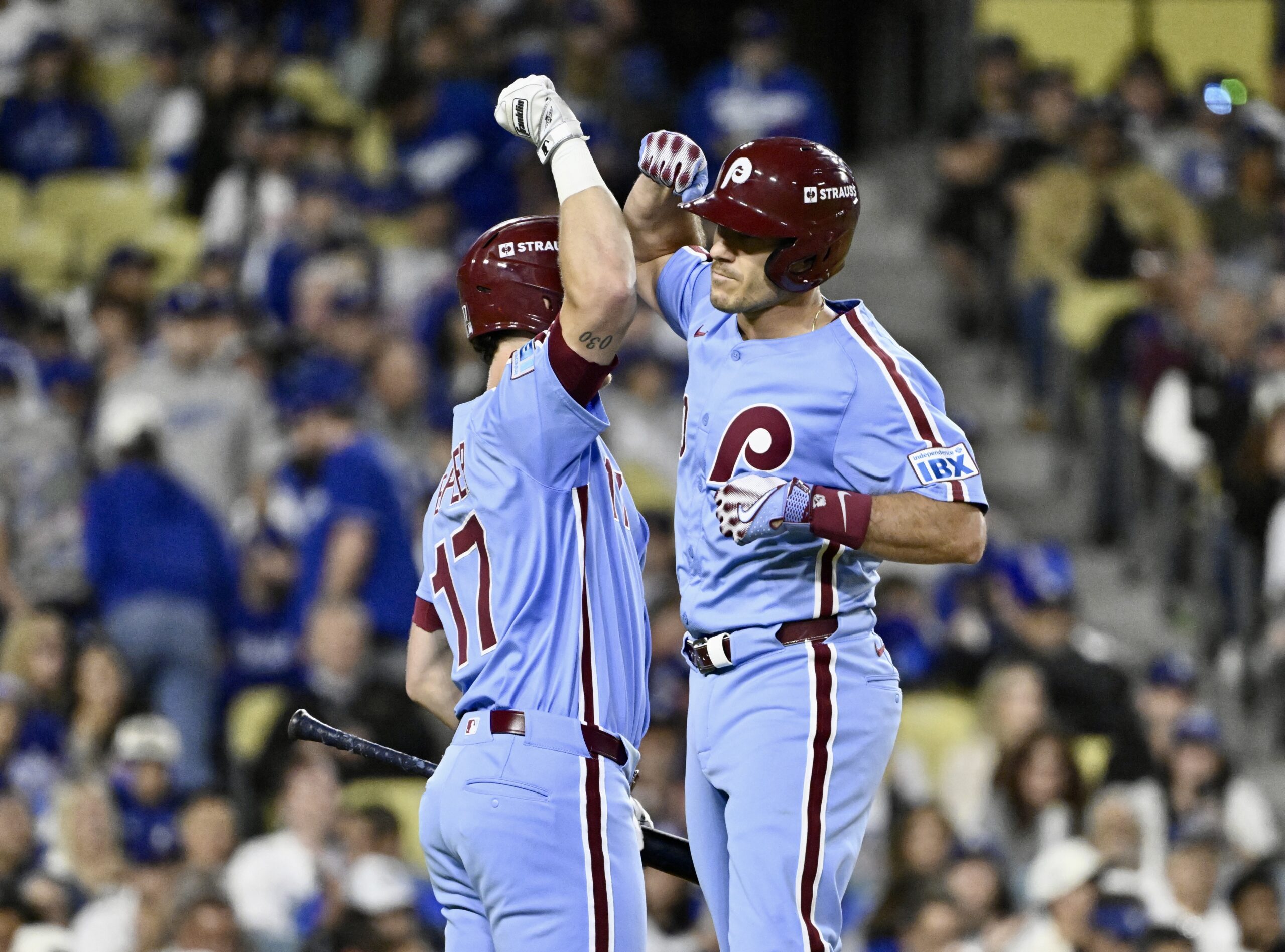 The Philadelphia Phillies’ J.T. Realmuto, right, celebrates with teammate Max...