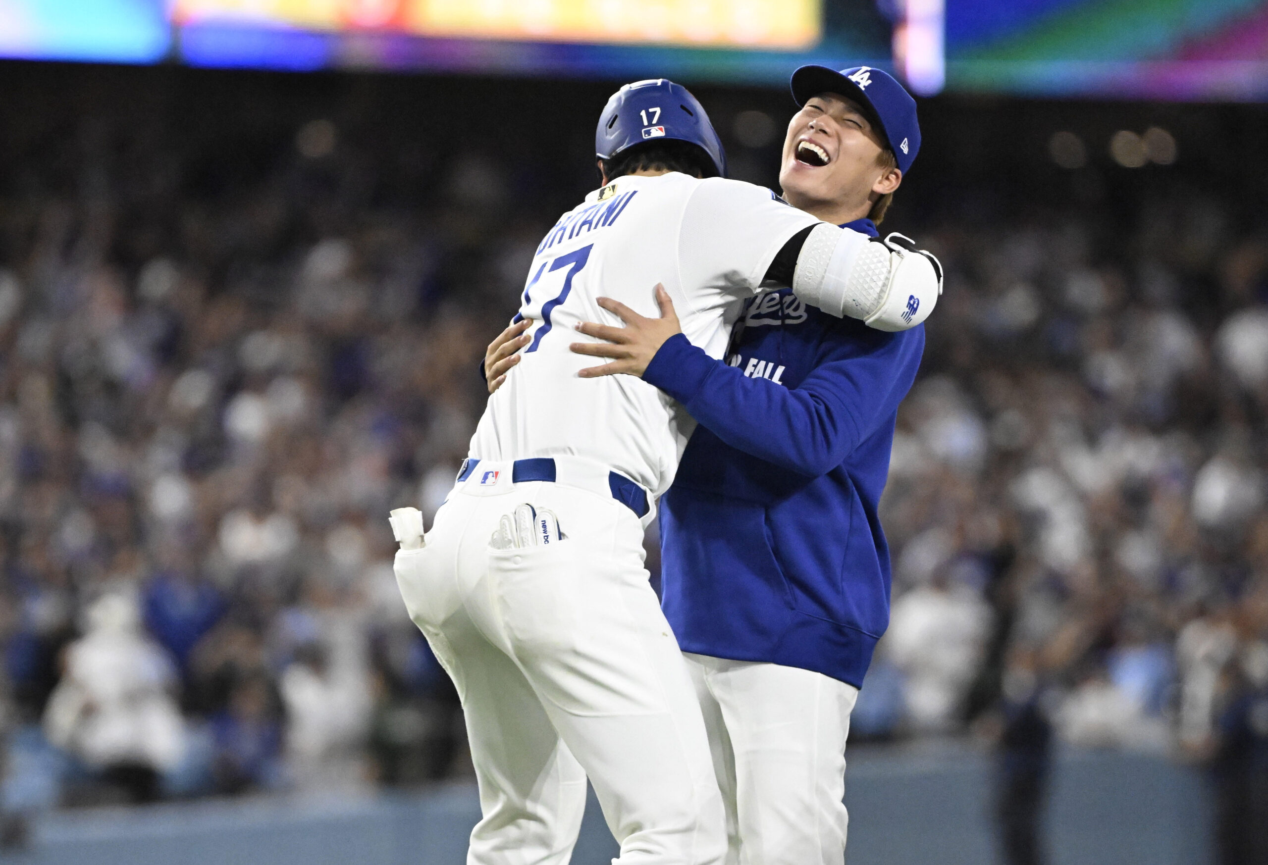 Shohei Ohtani #17 celebrates with teammate Yoshinobu Yamamoto #18 of...
