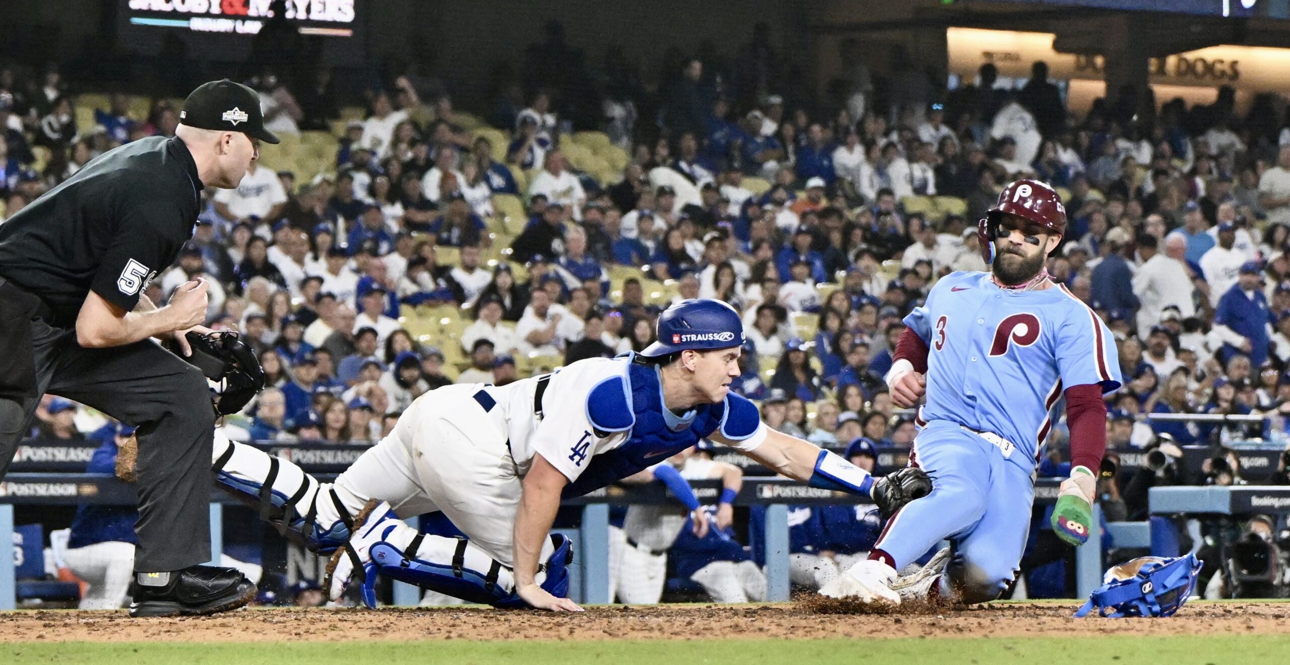 Dodgers catcher Will Smith tags out the Philadelphia Phillies’ Bryce...