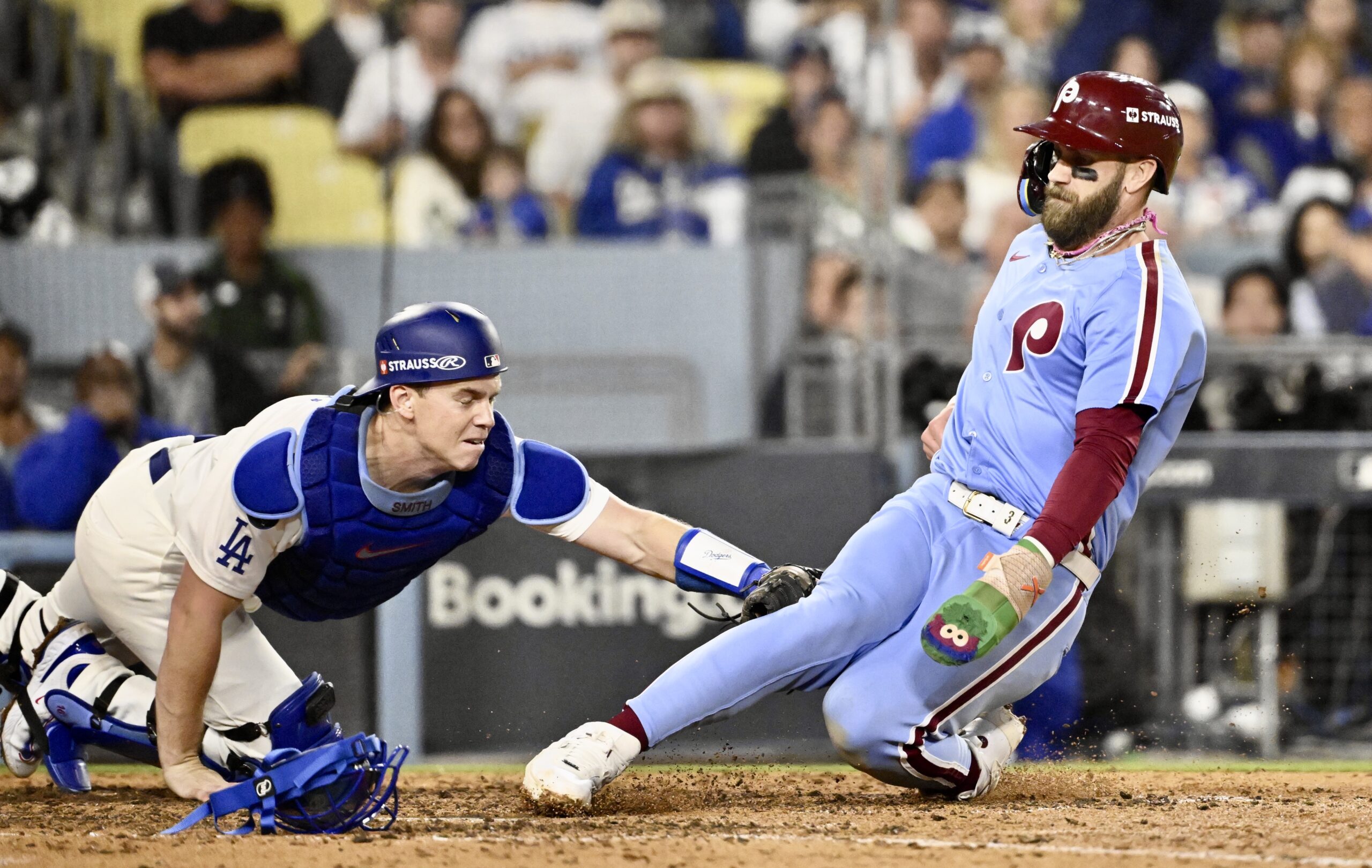 Dodgers catcher Will Smith tags out the Philadelphia Phillies’ Bryce...