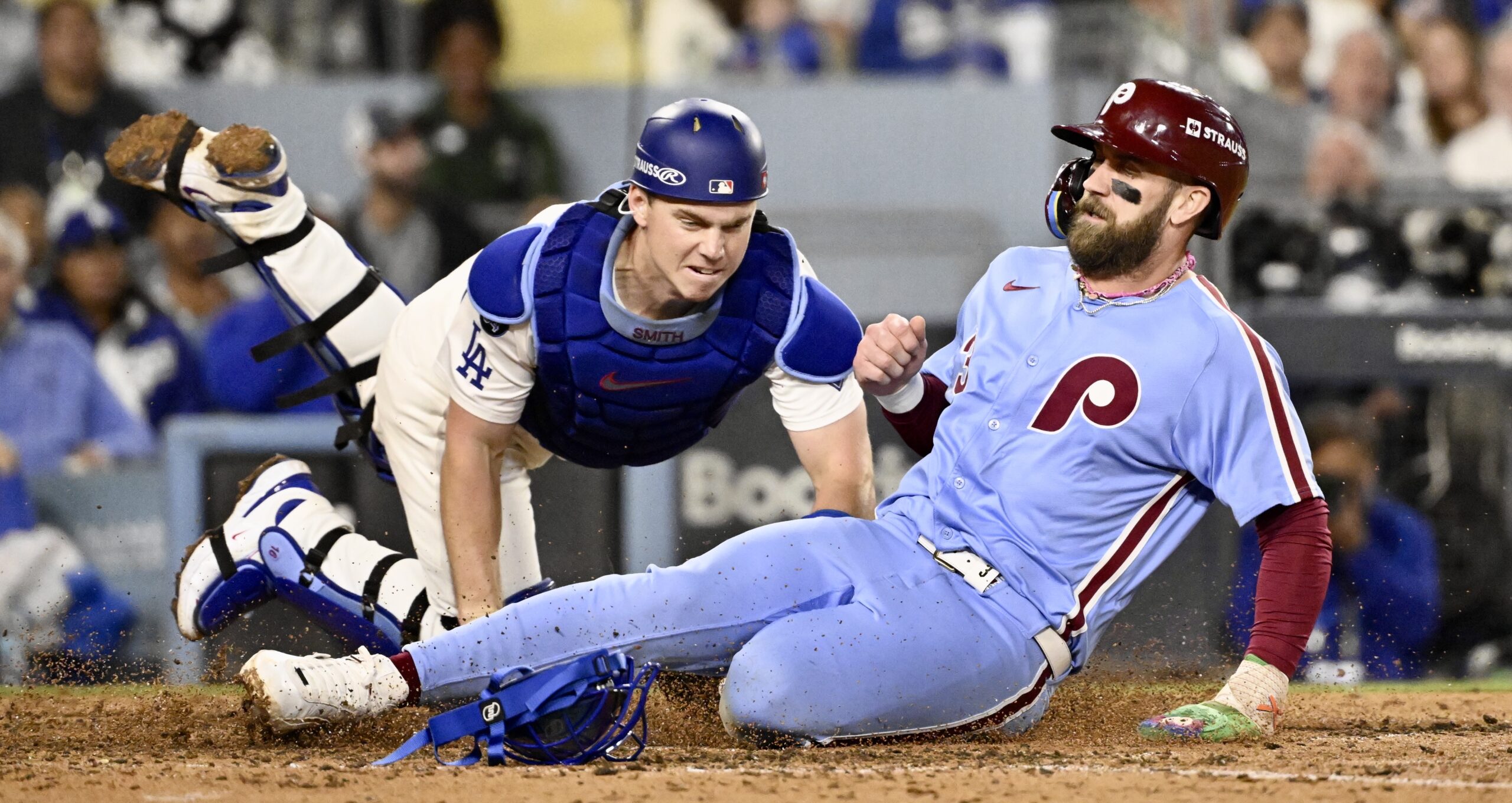 Dodgers catcher Will Smith tags out the Philadelphia Phillies’ Bryce...