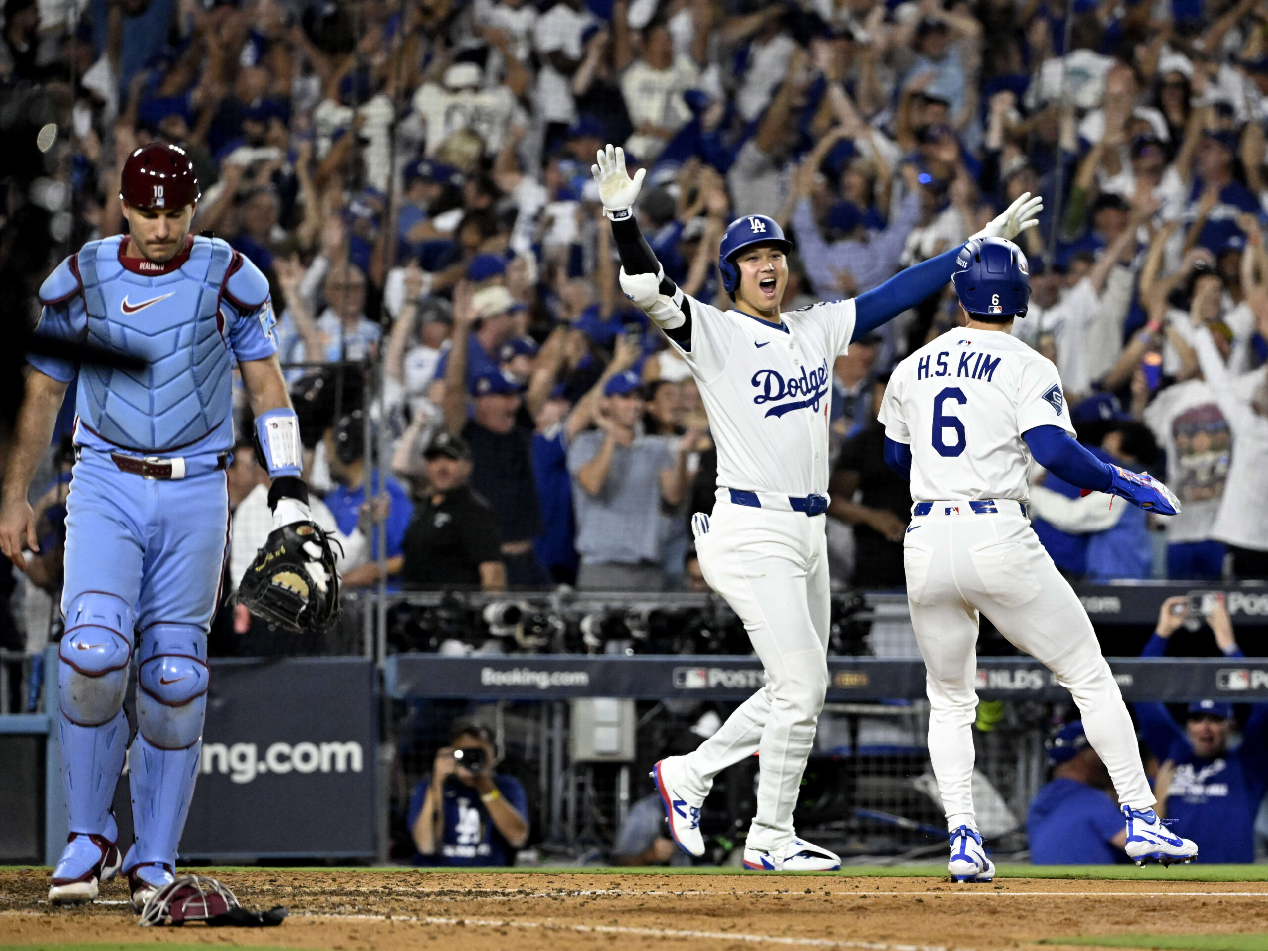 Shohei Ohtani, left, celebrates with teammate Hyeseong Kim #6 of...