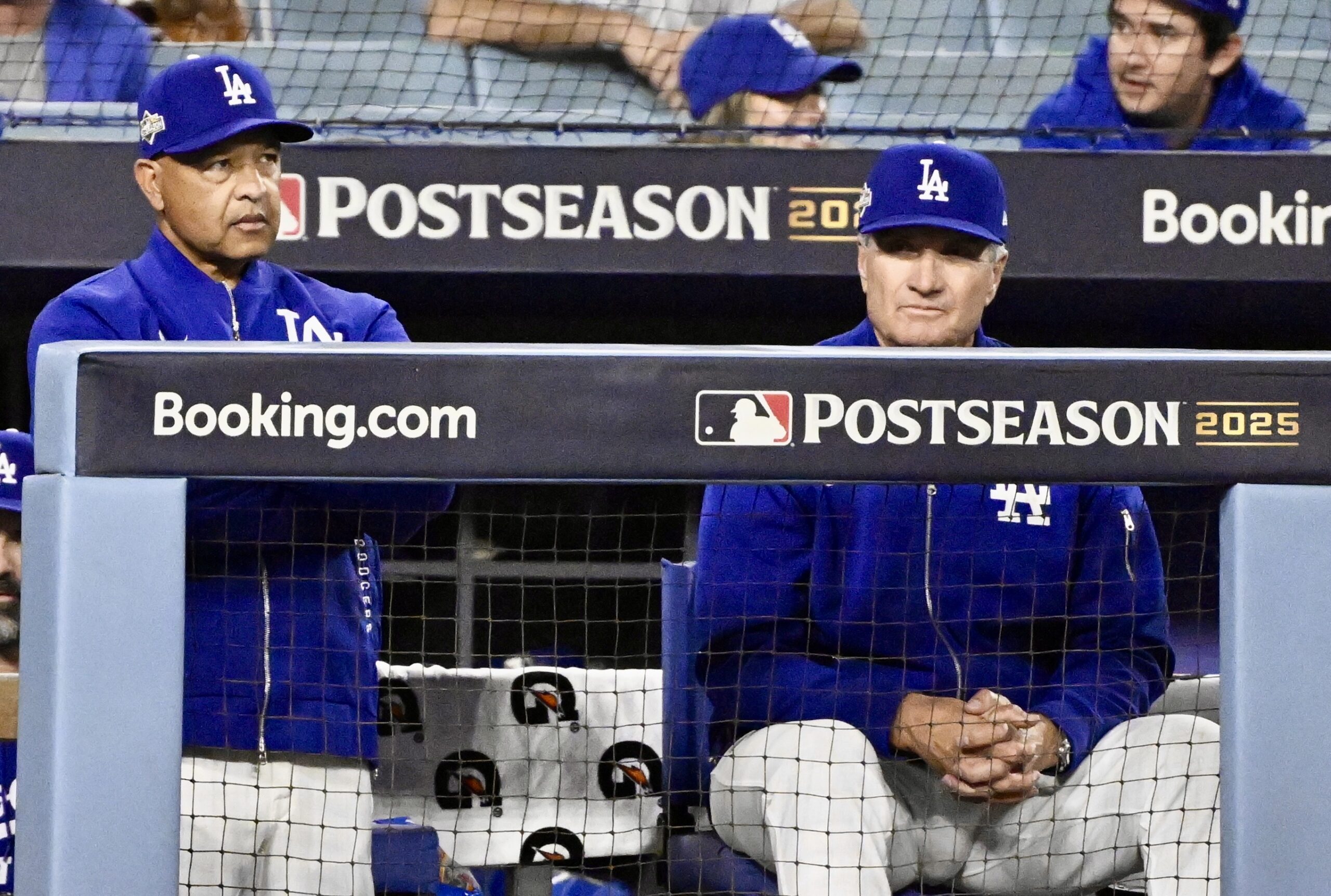 Dodgers manager Dave Roberts, left, along with coach Bob Geren...