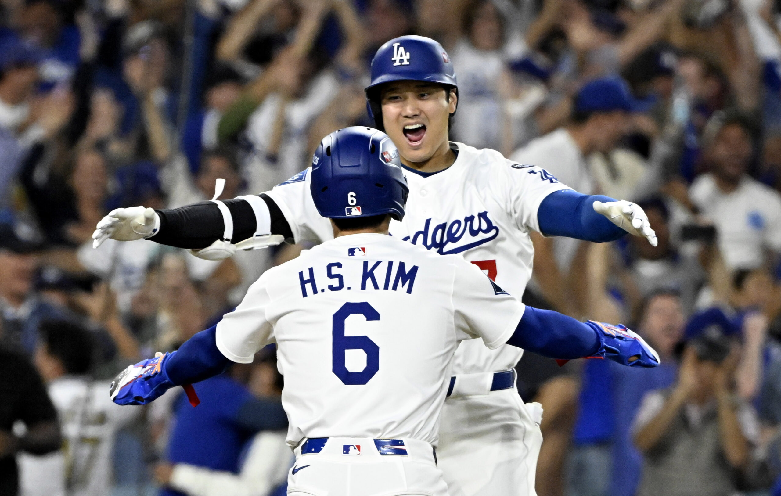 Shohei Ohtani, left, celebrates with teammate Hyeseong Kim #6 of...
