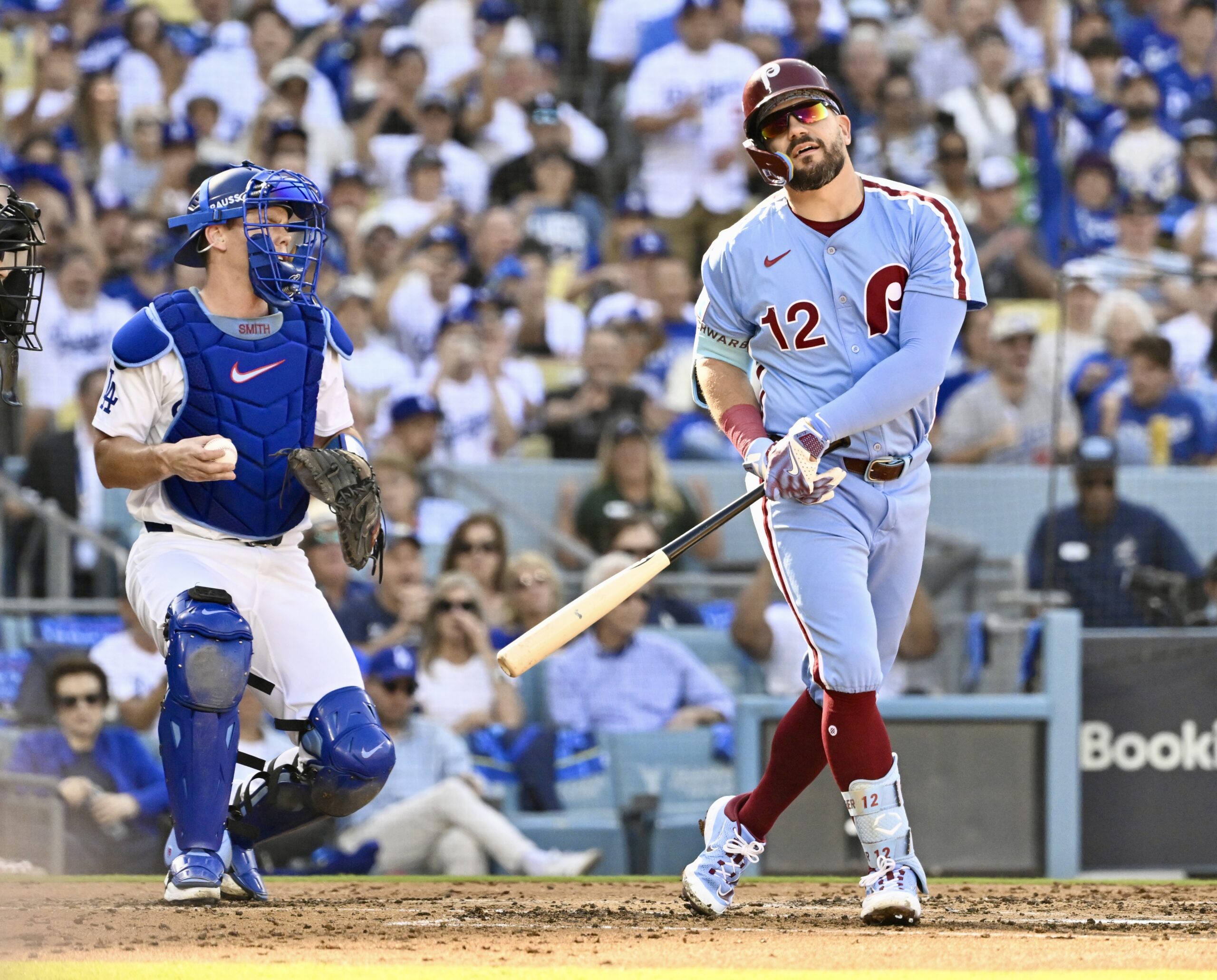 Philadelphia Phillies slugger Kyle Schwarber reacts after striking out as...