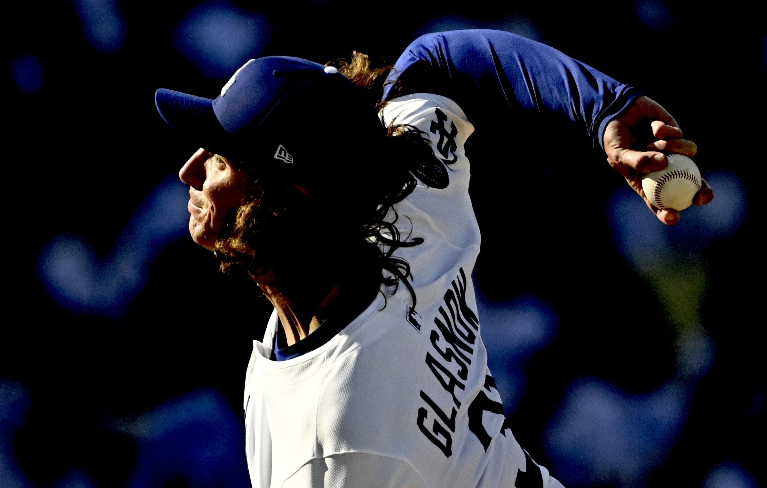Dodgers starting pitcher Tyler Glasnow throws to the plate during...