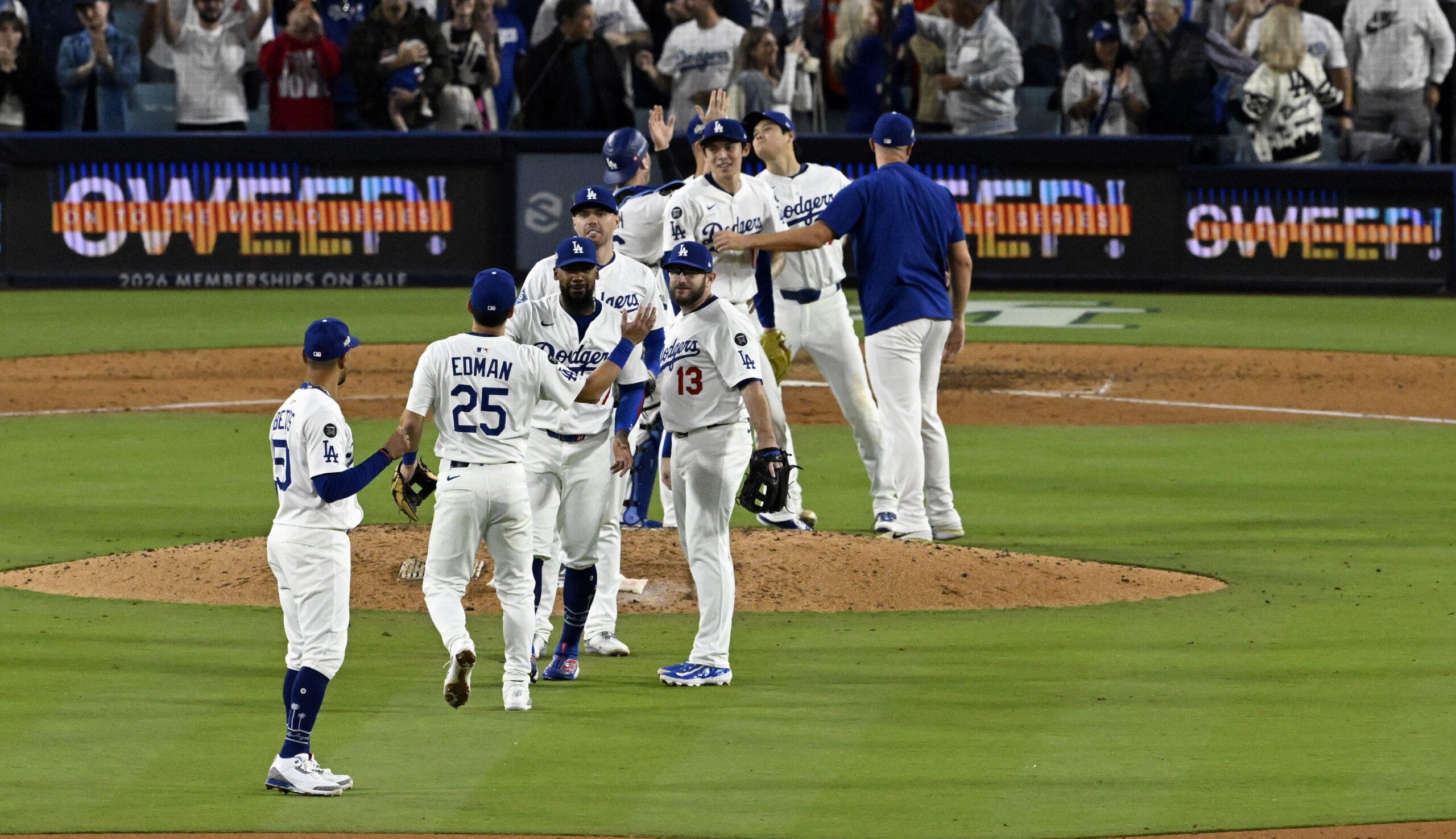 The Los Angeles Dodgers celebrate after defeating the Milwaukee Brewers...