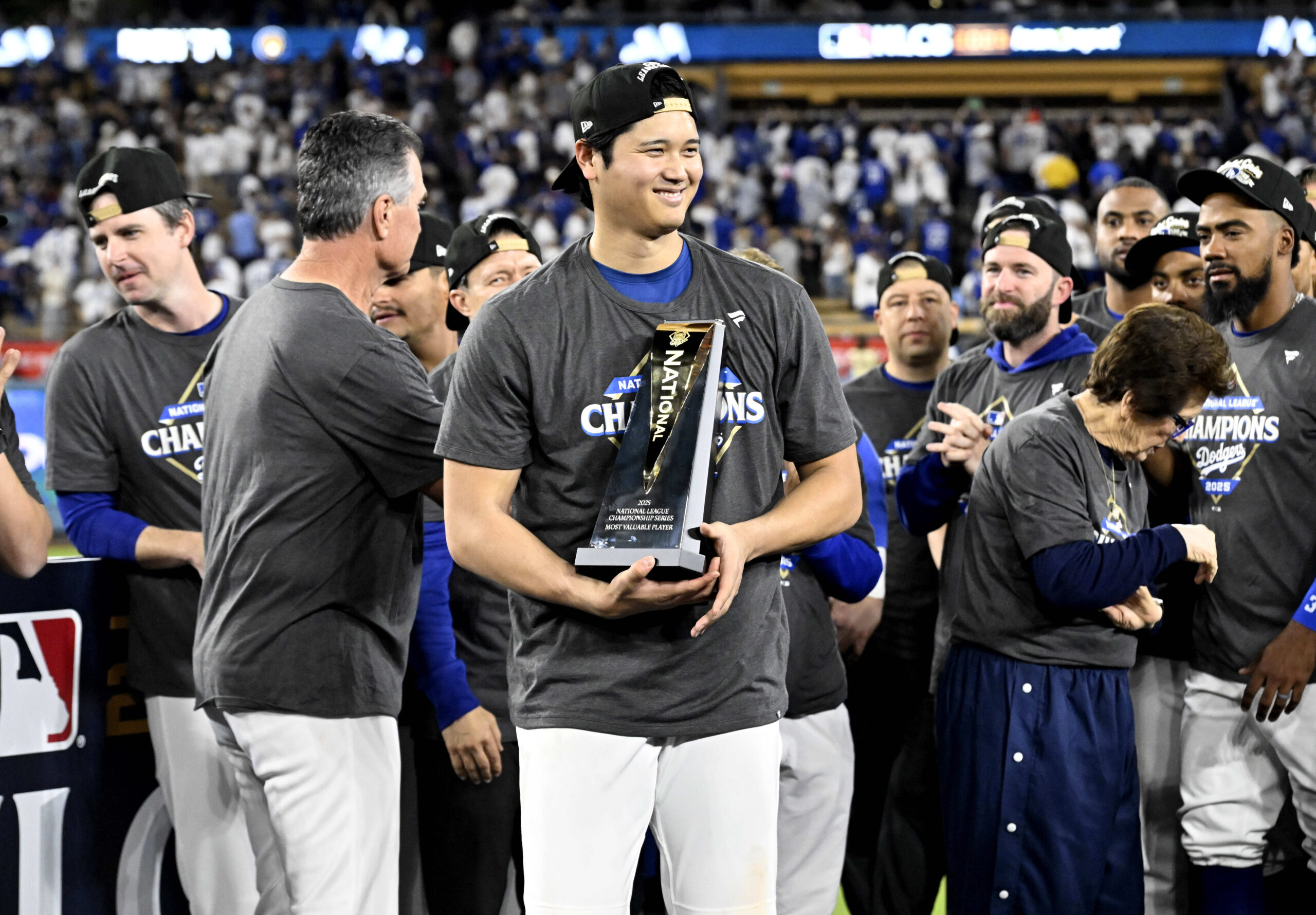 Dodgers star Shohei Ohtani holds the NLCS MVP trophy after...