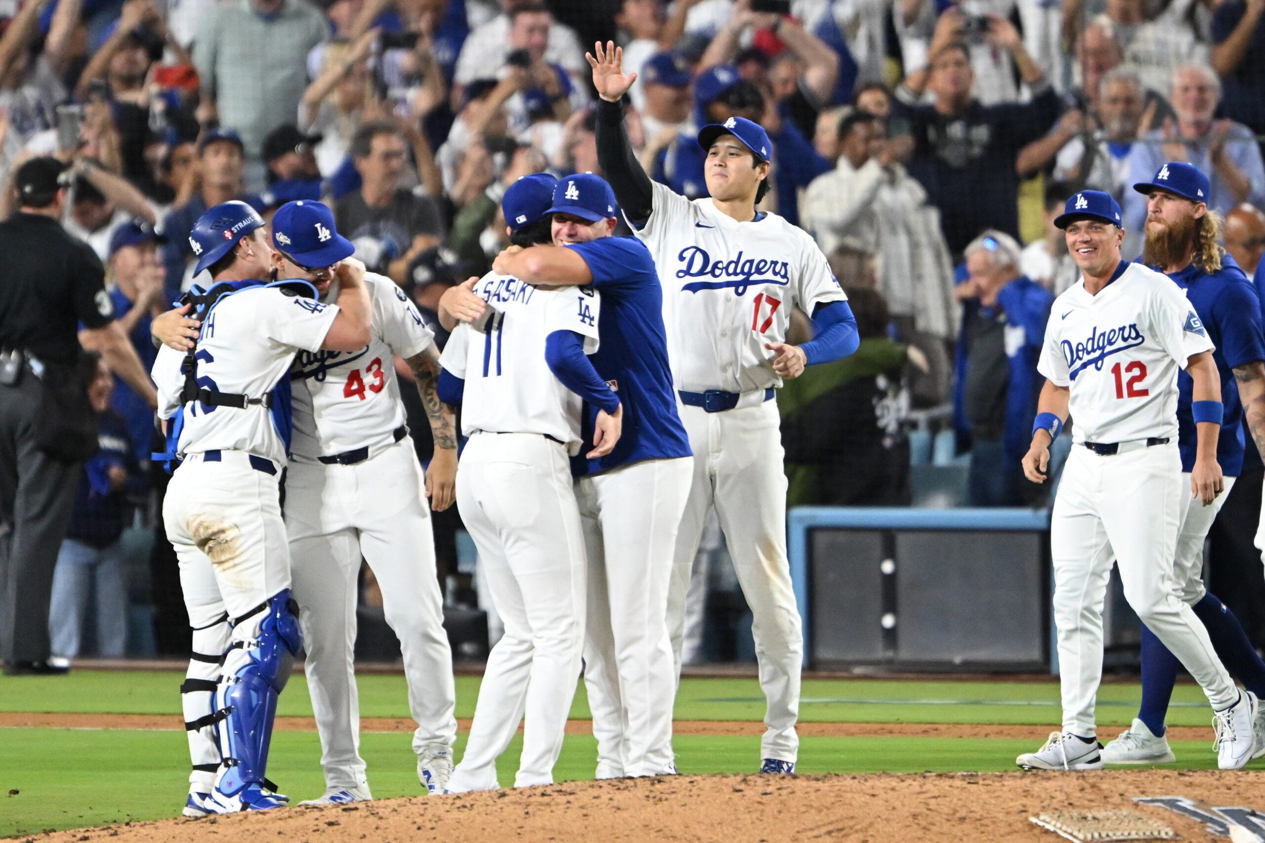 The Dodgers celebrate after their 5-1 victory over the Milwaukee...