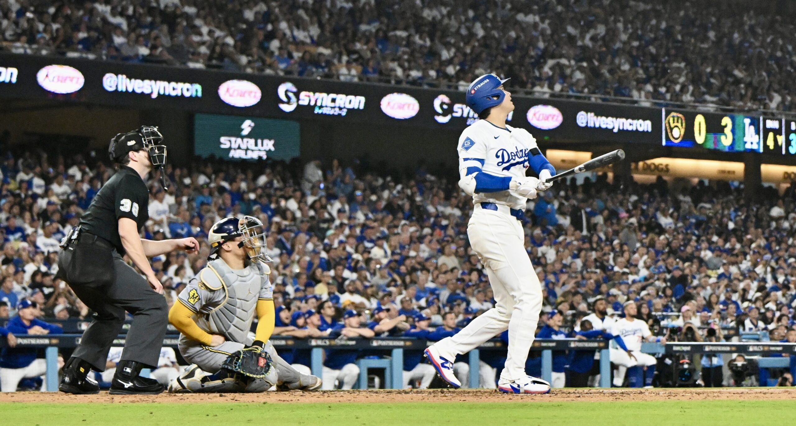 Dodgers star Shohei Ohtani watches the flight of his titanic...