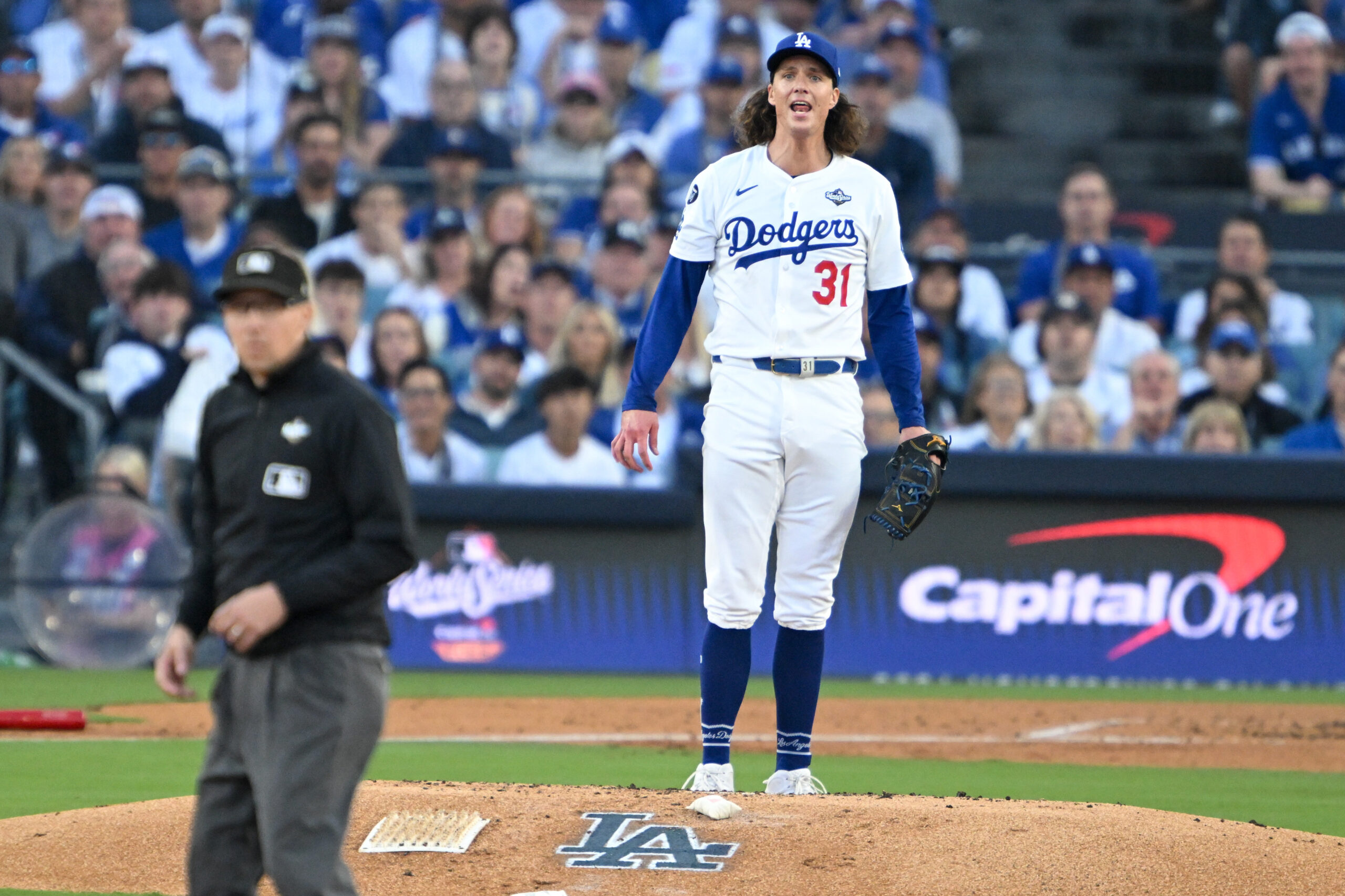Dodgers starting pitcher Tyler Glasnow (31) watches a fly ball...