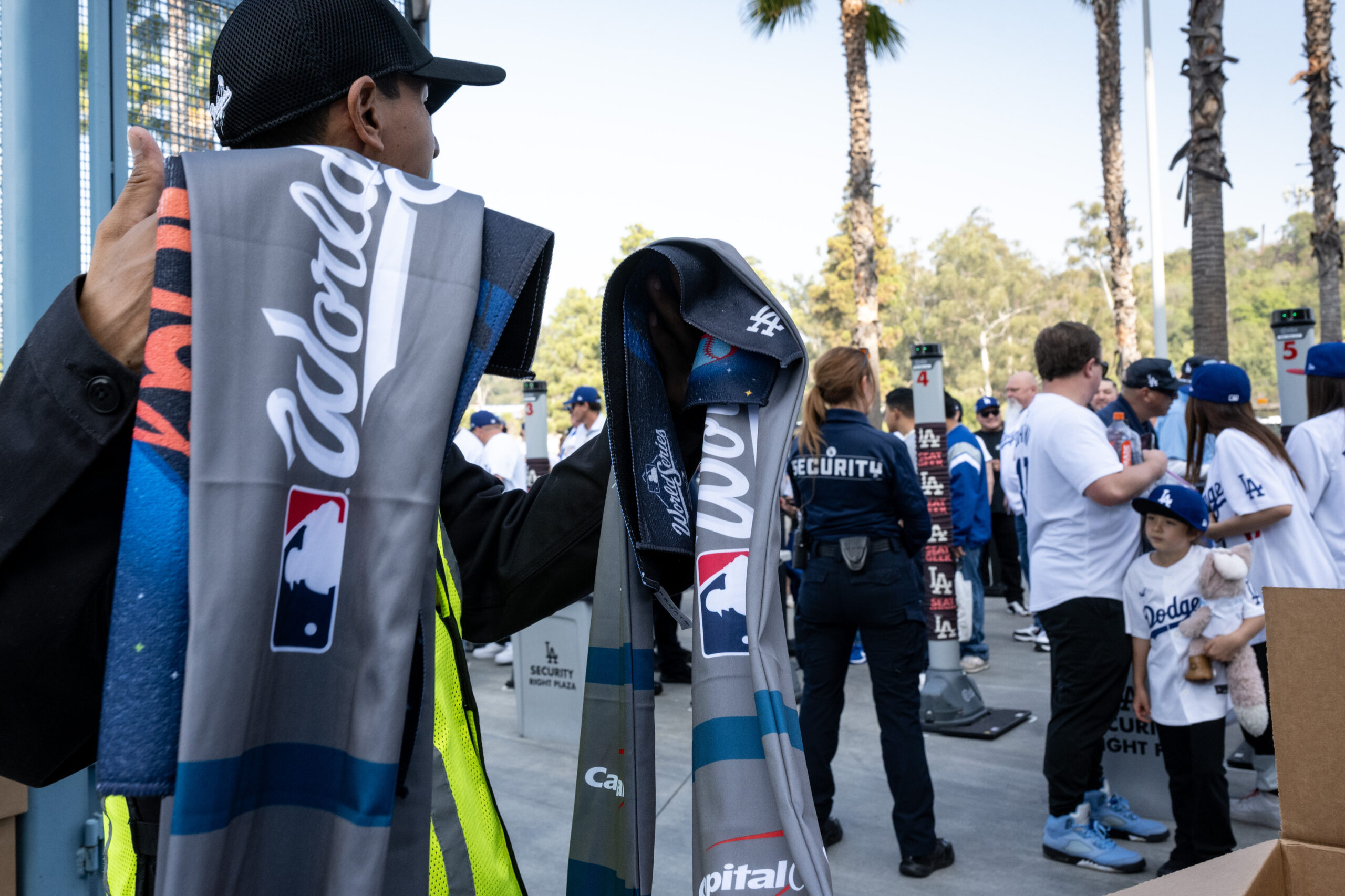 Fans get rally towels and scarves as they arrive for...