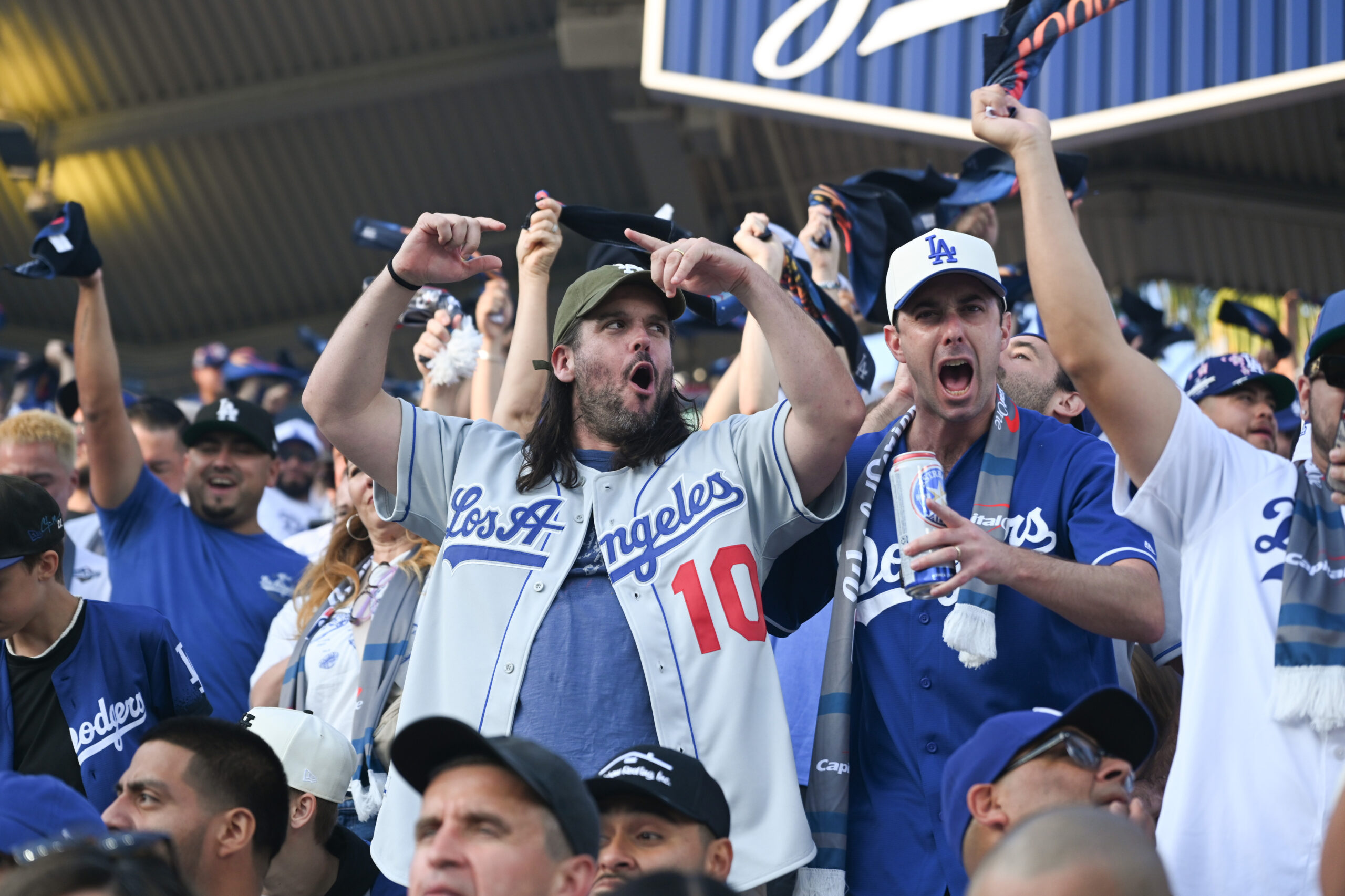 Dodger fans cheer in the stands during the first inning...