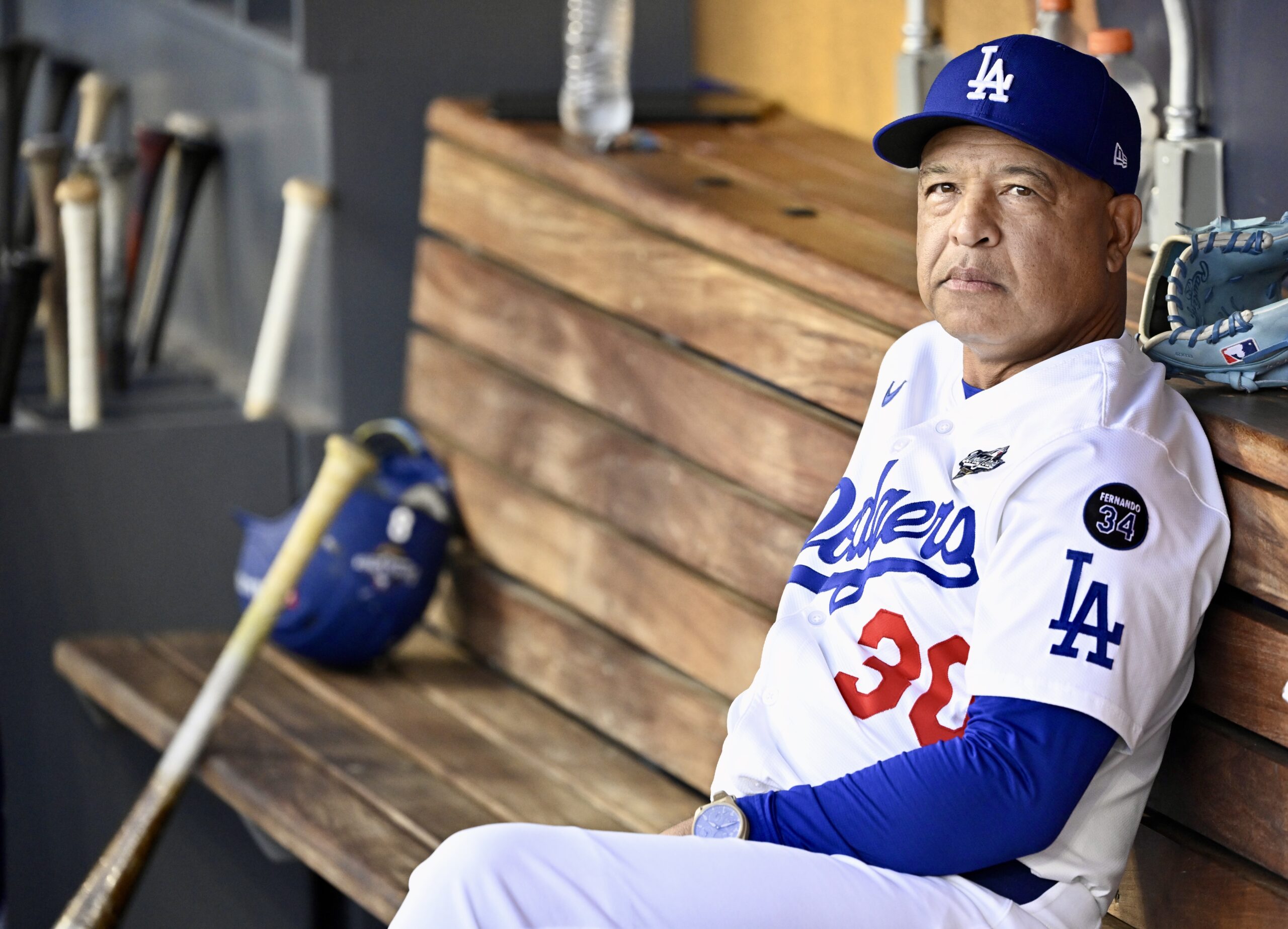 Dodgers manager Dave Roberts looks on from the dugout before...
