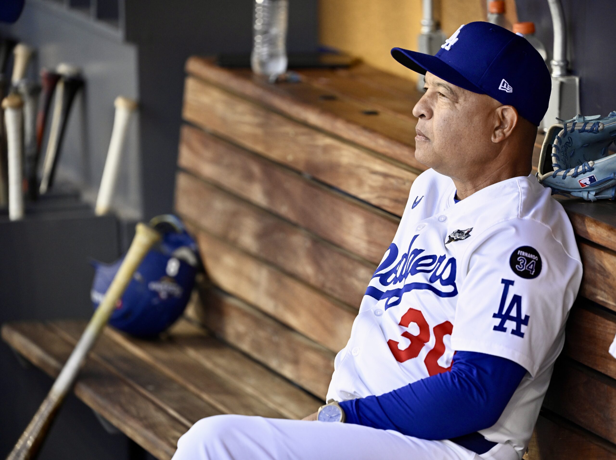 Dodgers manager Dave Roberts looks on from the dugout before...
