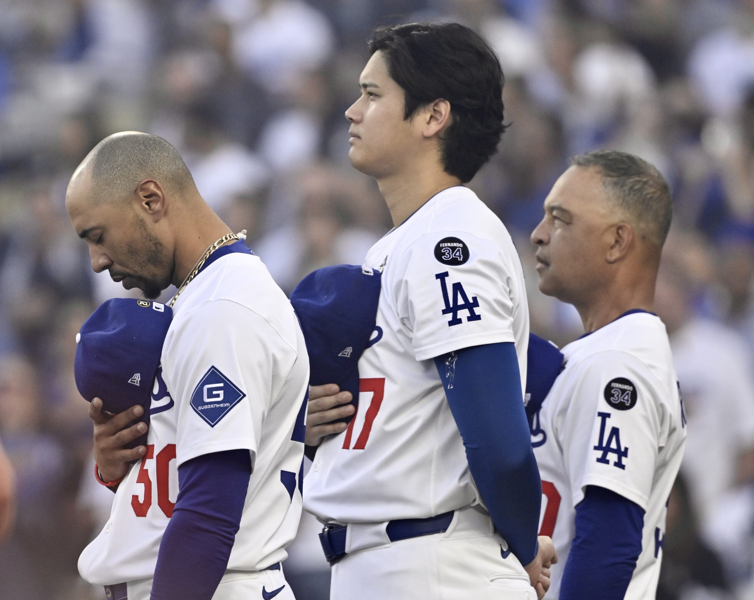 Dodgers star Shohei Ohtani, center, along with shortstop Mookie Betts,...