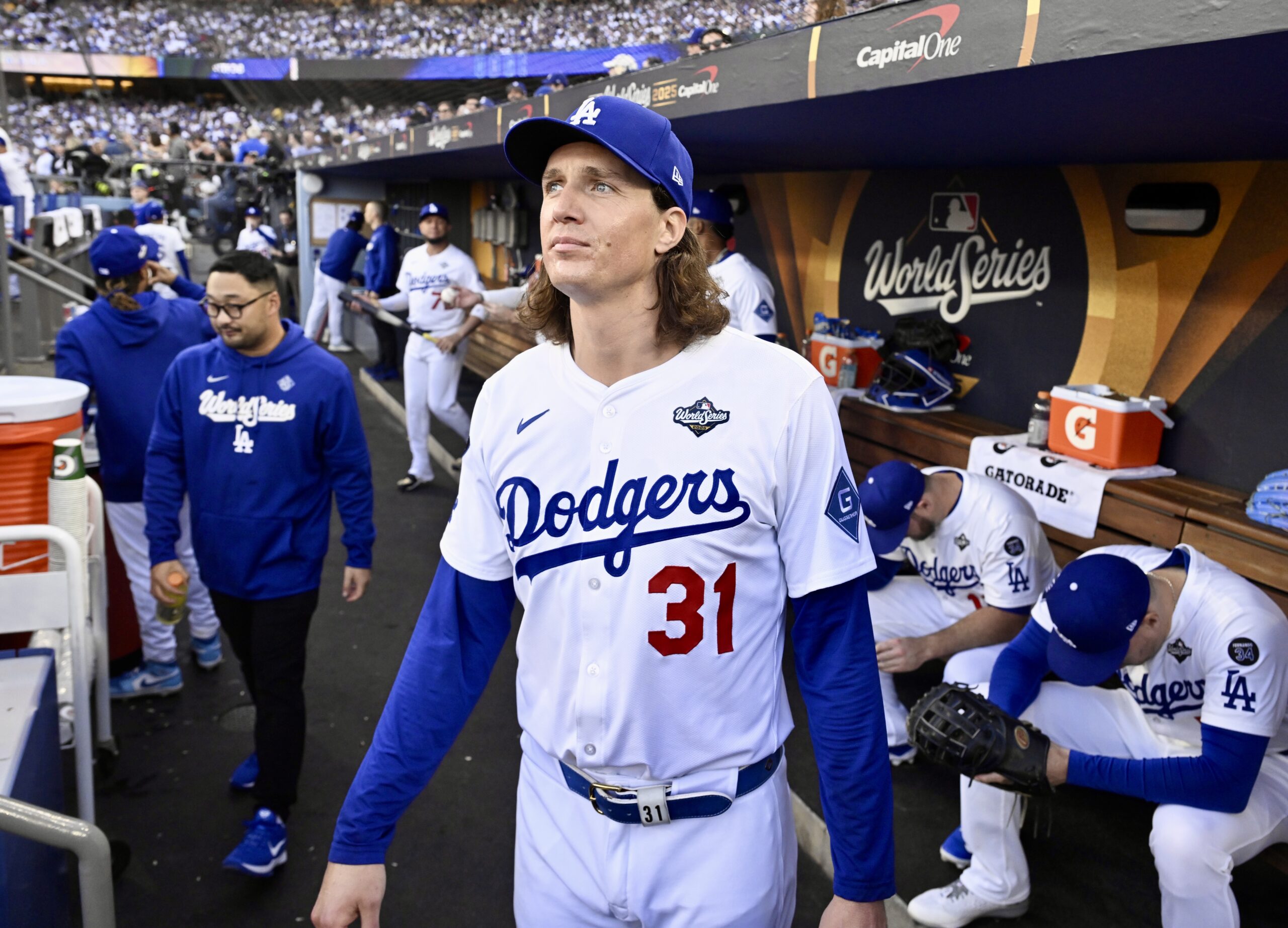 Dodgers starting pitcher Tyler Glasnow looks on from the dugout...