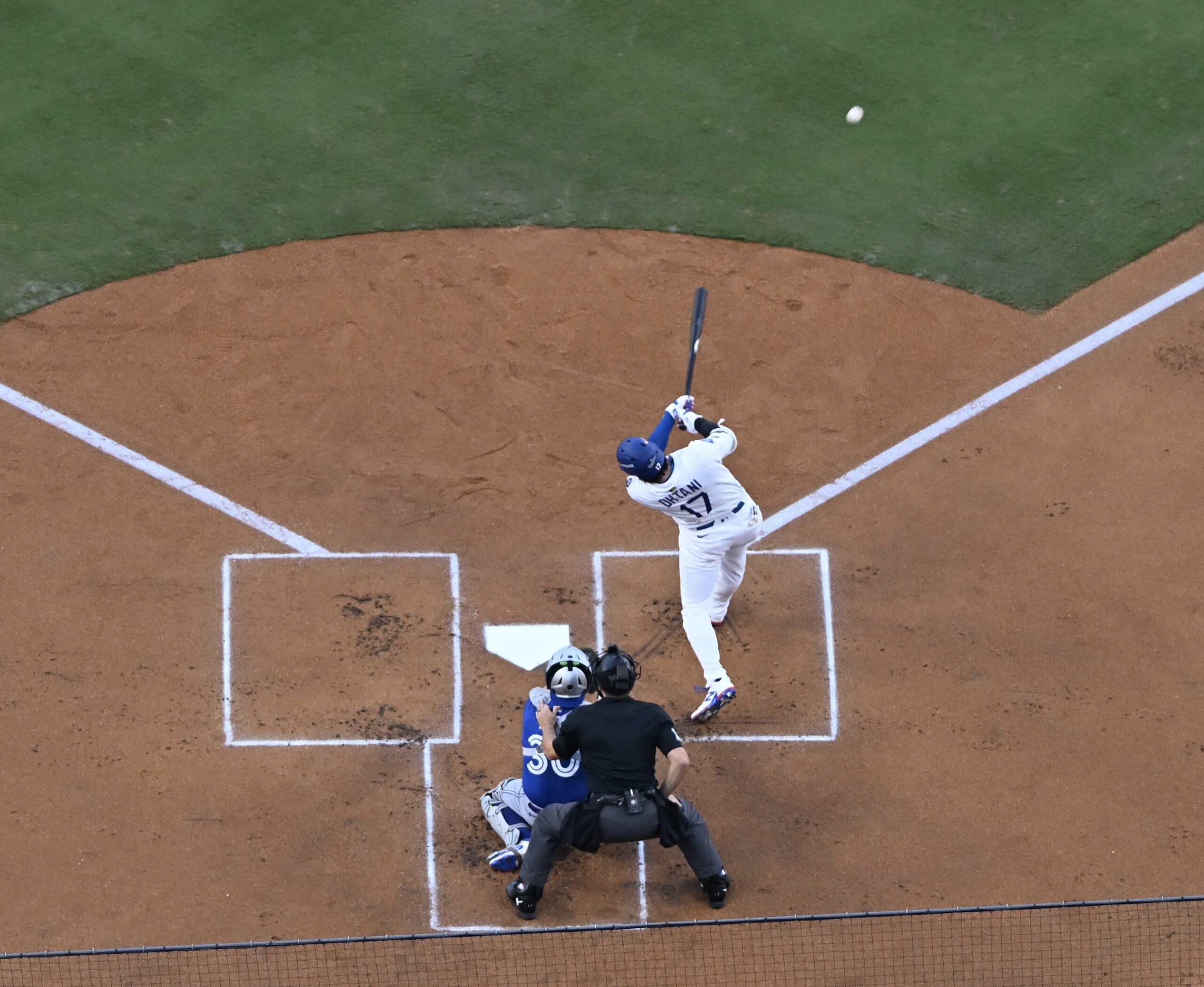 Dodgers star Shohei Ohtani hits a double during the first...