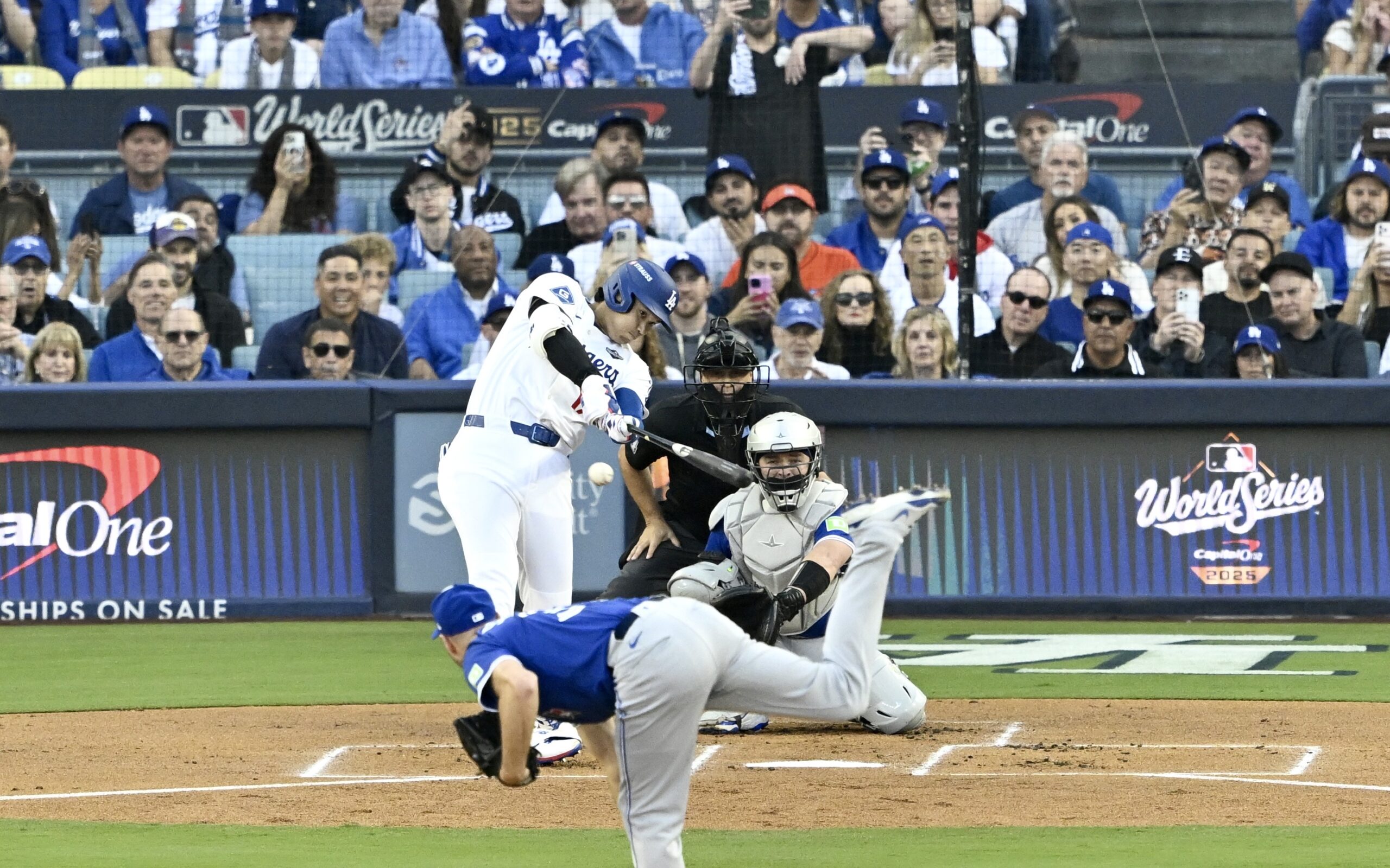 Dodgers star Shohei Ohtani hits a double during the first...
