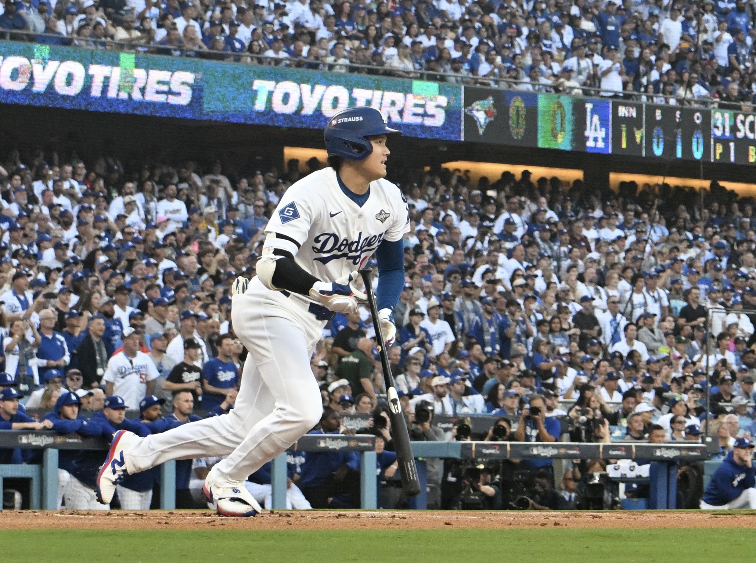 Dodgers star Shohei Ohtani hits a double during the first...