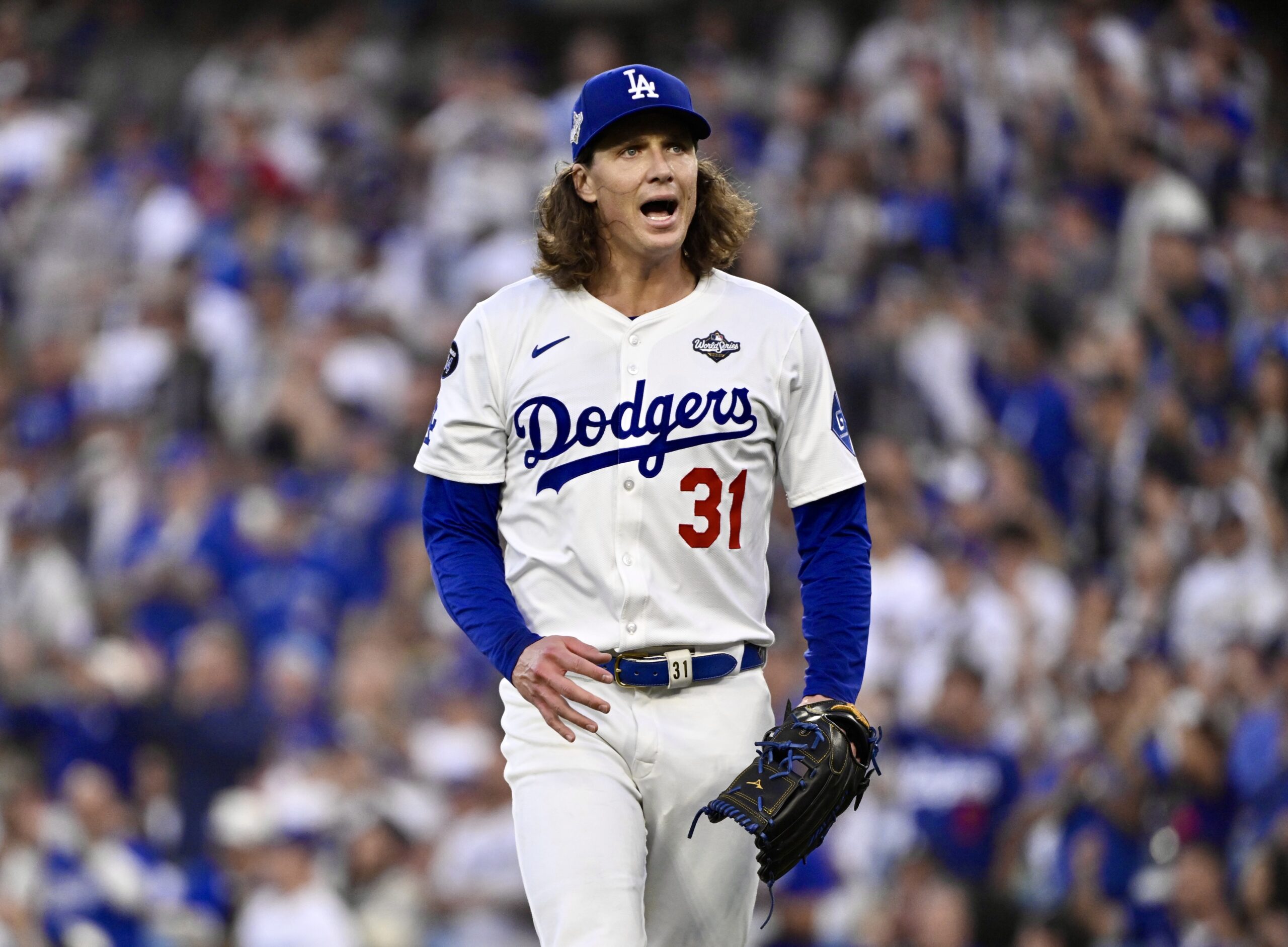 Dodgers starting pitcher Tyler Glasnow reacts after getting out a...