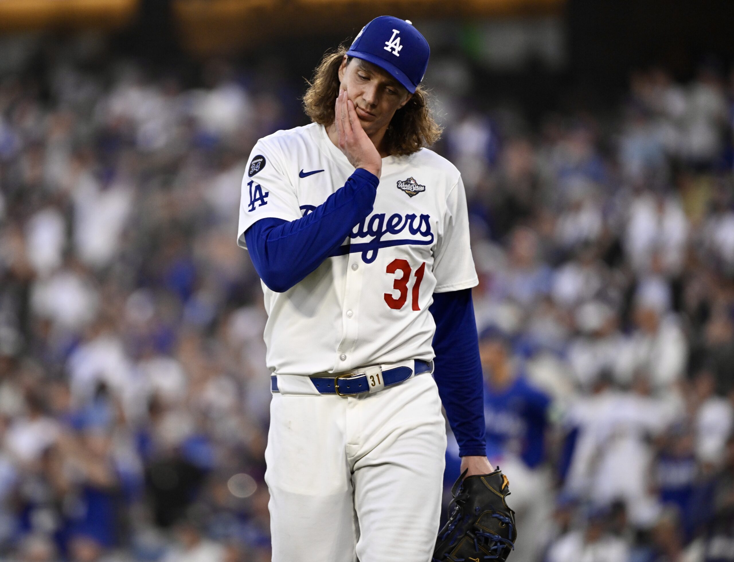 Dodgers starting pitcher Tyler Glasnow reacts after getting out a...