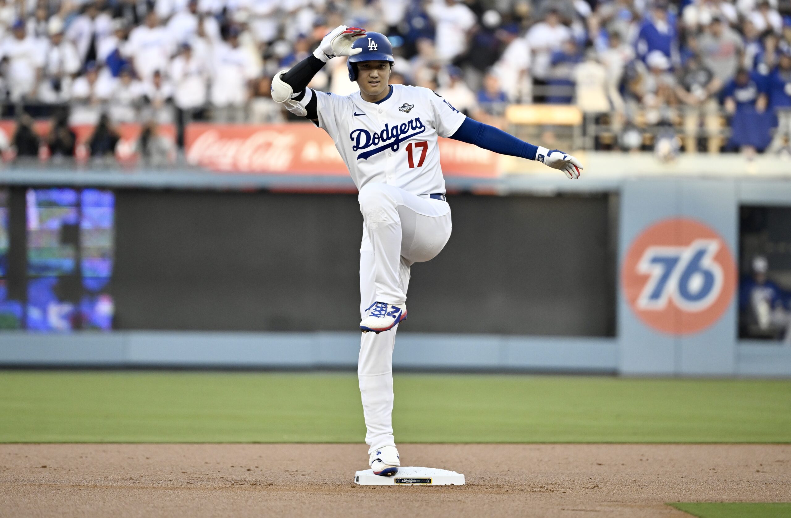 Dodgers star Shohei Ohtani gestures at second base after hitting...