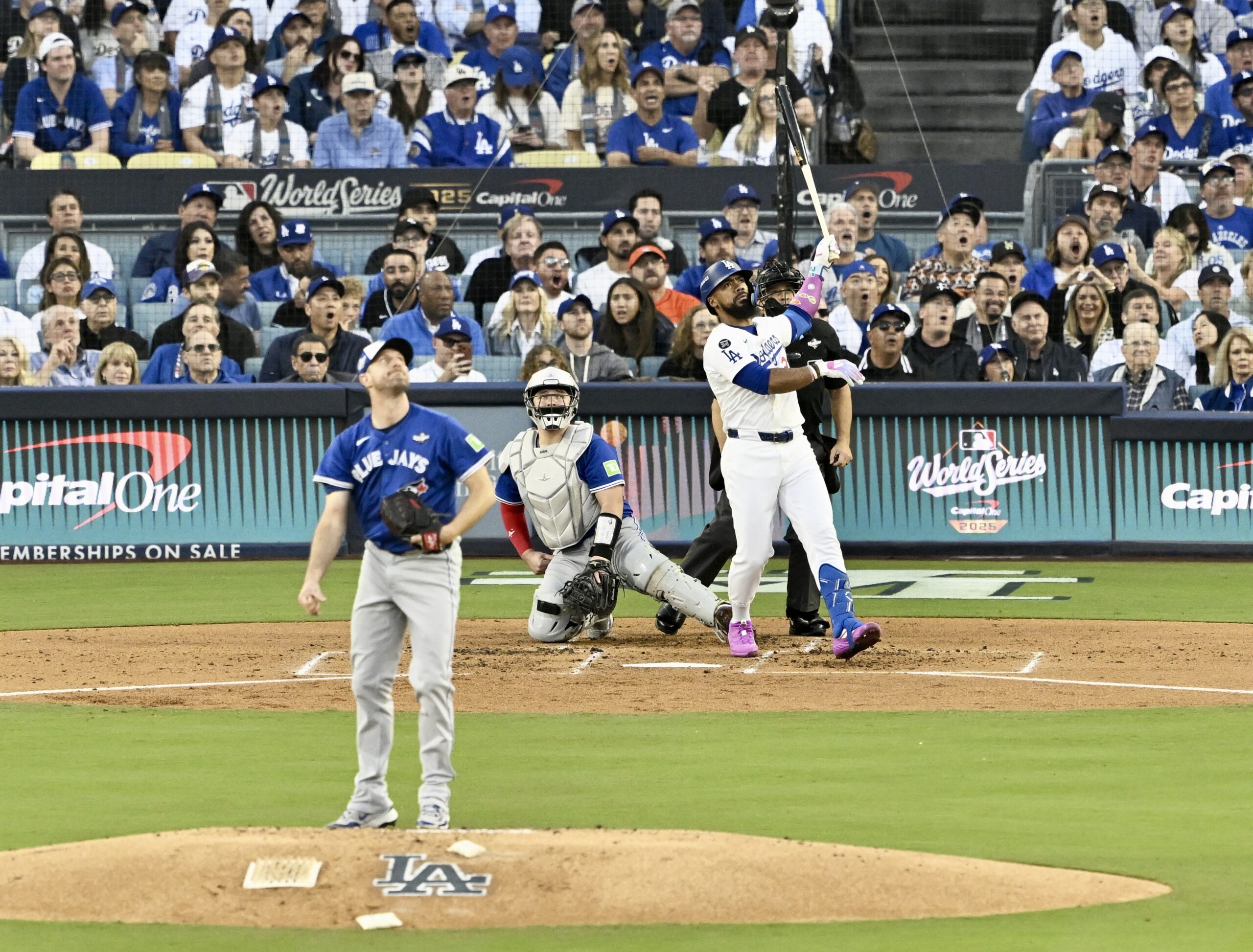 The Dodgers’ Teoscar Hernández, right, watches the flight of his...
