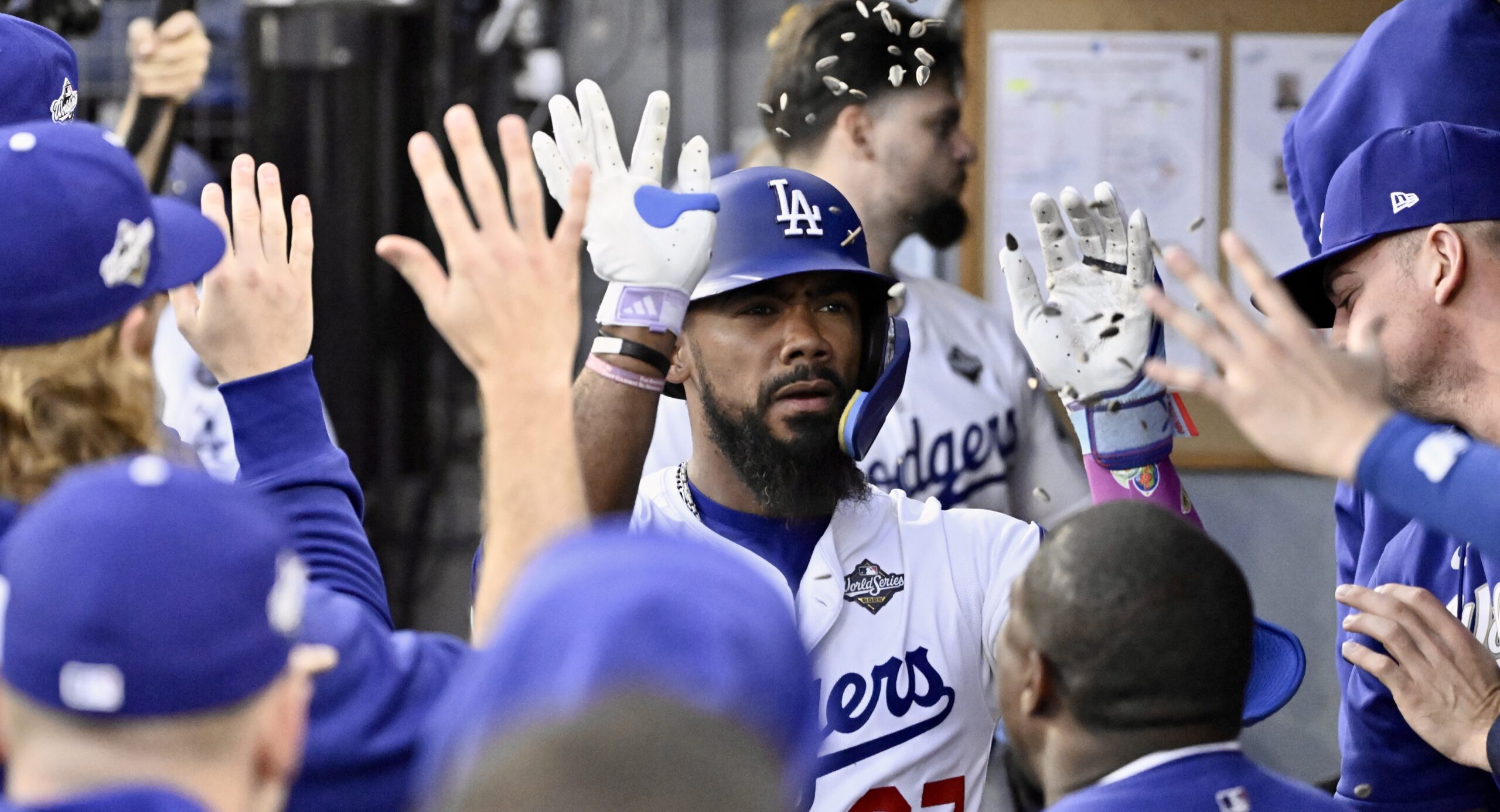 The Dodgers’ Teoscar Hernández celebrates in the dugout after hitting...