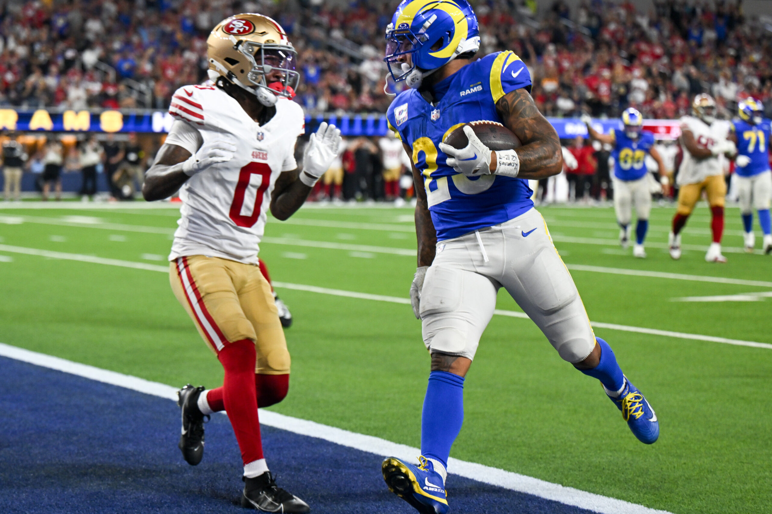 Rams Kyren Williams (23) walked in with this TD as...