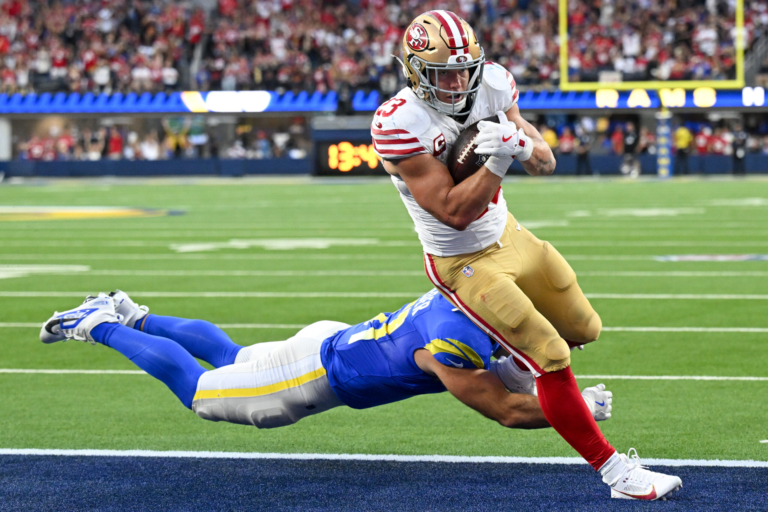 San Francisco 49ers running back Christian McCaffrey scores a touchdown...