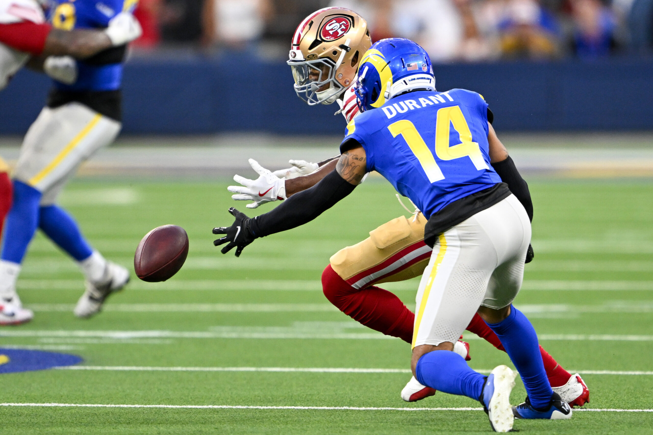 Rams defensive back Decobie Durant (14) breaks up a pass...