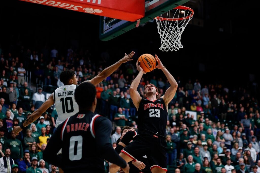 Dec 6, 2023; Fort Collins, Colorado, USA; Denver Pioneers guard Jaxon Brenchley (23) drives to the net against Colorado State Rams guard Nique Clifford (10) in the first half at Moby Arena. Mandatory Credit: Isaiah J. Downing-USA TODAY Sports