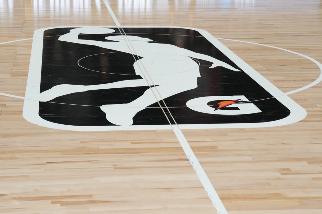 Feb 16, 2025; Oakland, California, USA; The NBA G-League Logo is seen at center court prior to a game between Team Strictly and Team Swish Cultures at Moscone Center. Mandatory Credit: Darren Yamashita-Imagn Images