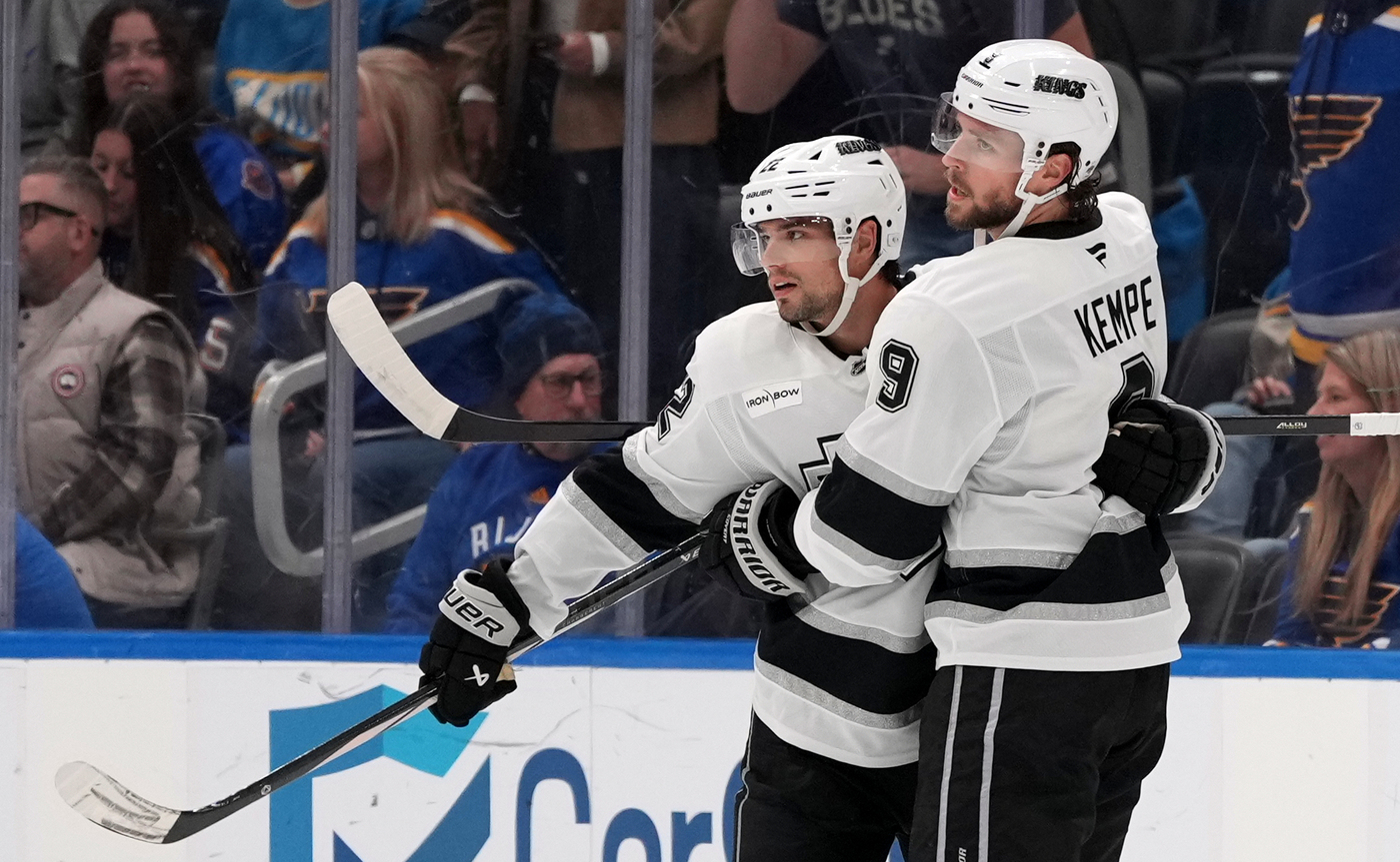 The Kings’ Adrian Kempe, right, is congratulated by teammate Kevin...