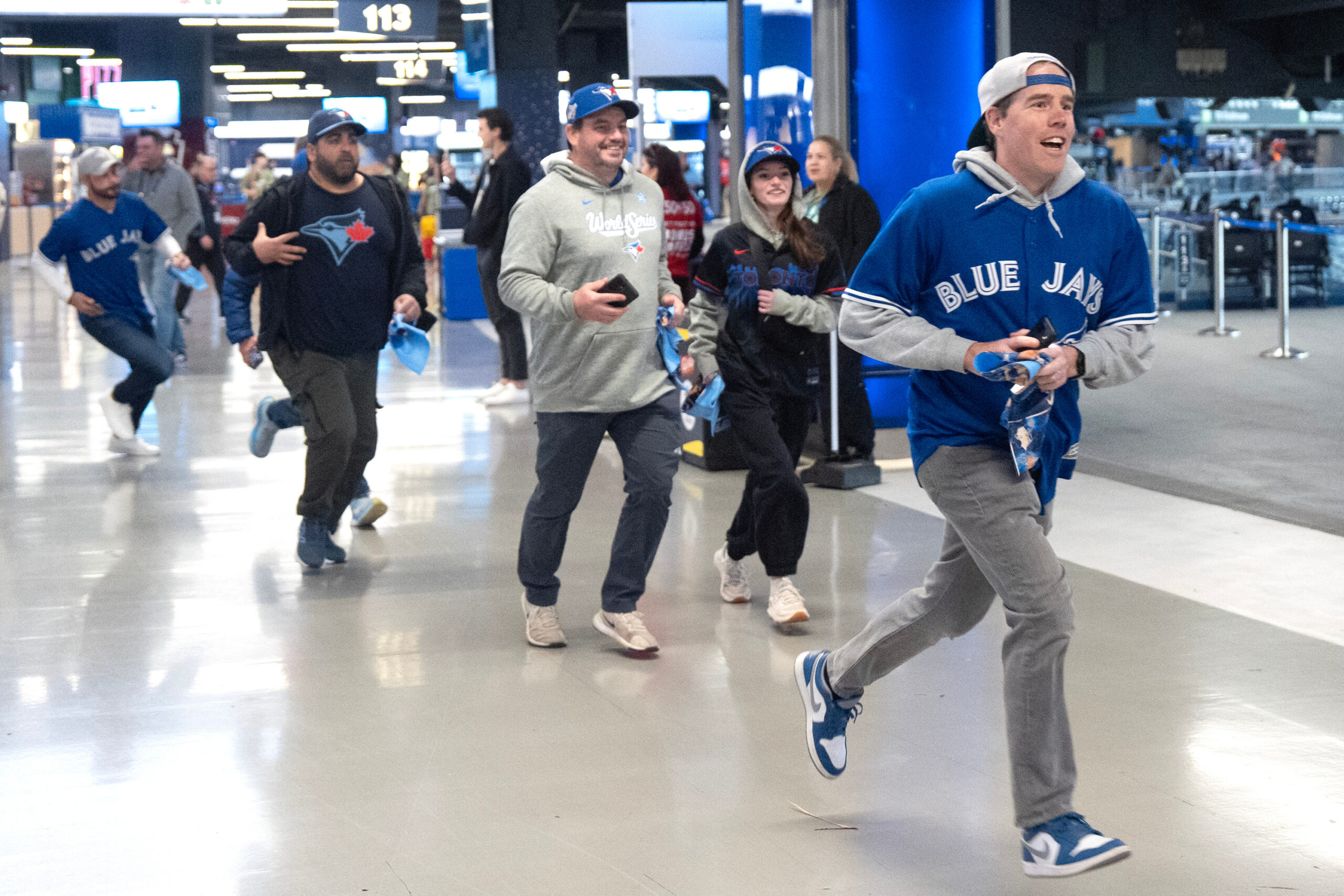 Toronto Blue Jays fans rush to gain a vantage point...