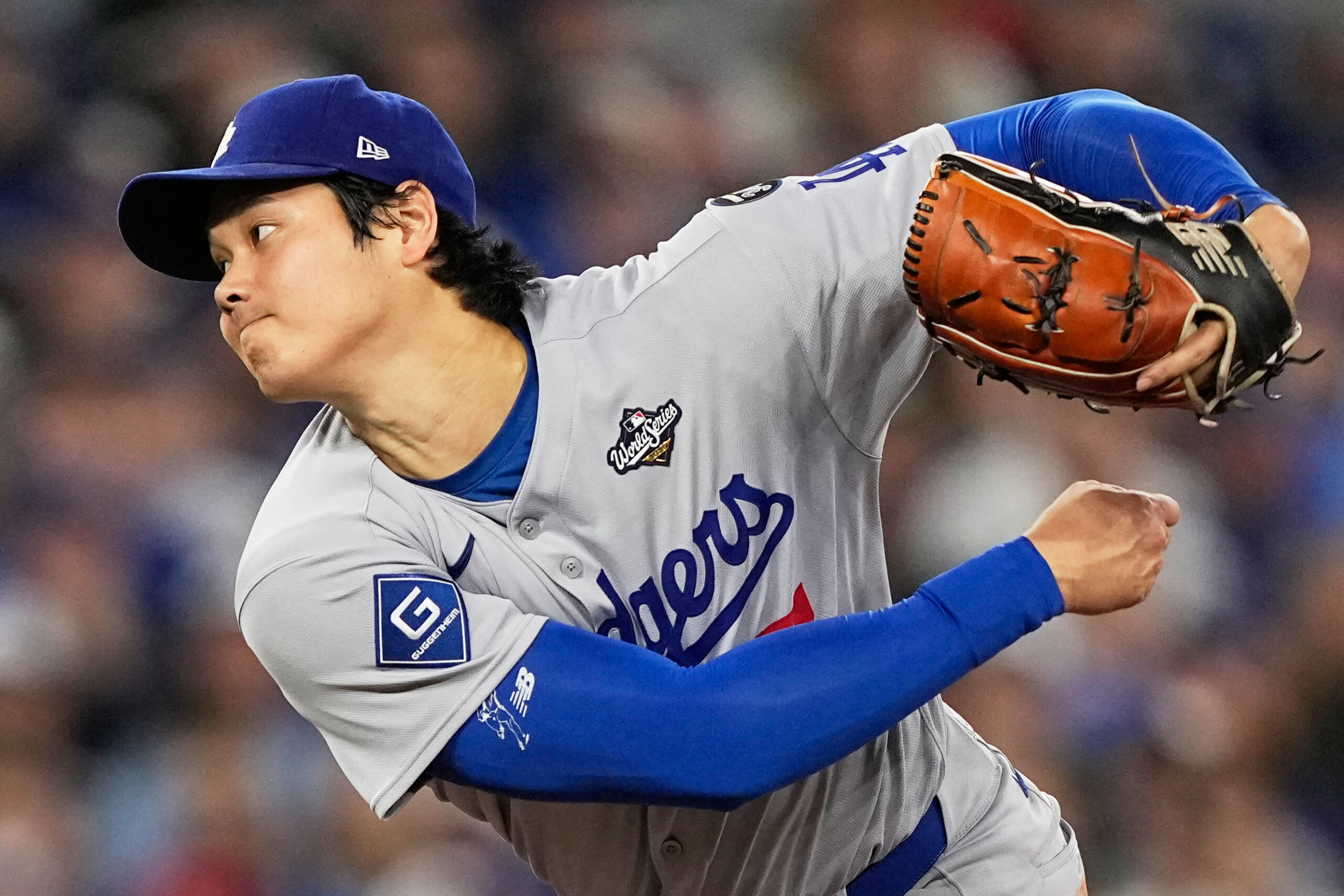 Dodgers starting pitcher Shohei Ohtani throws to the plate during...