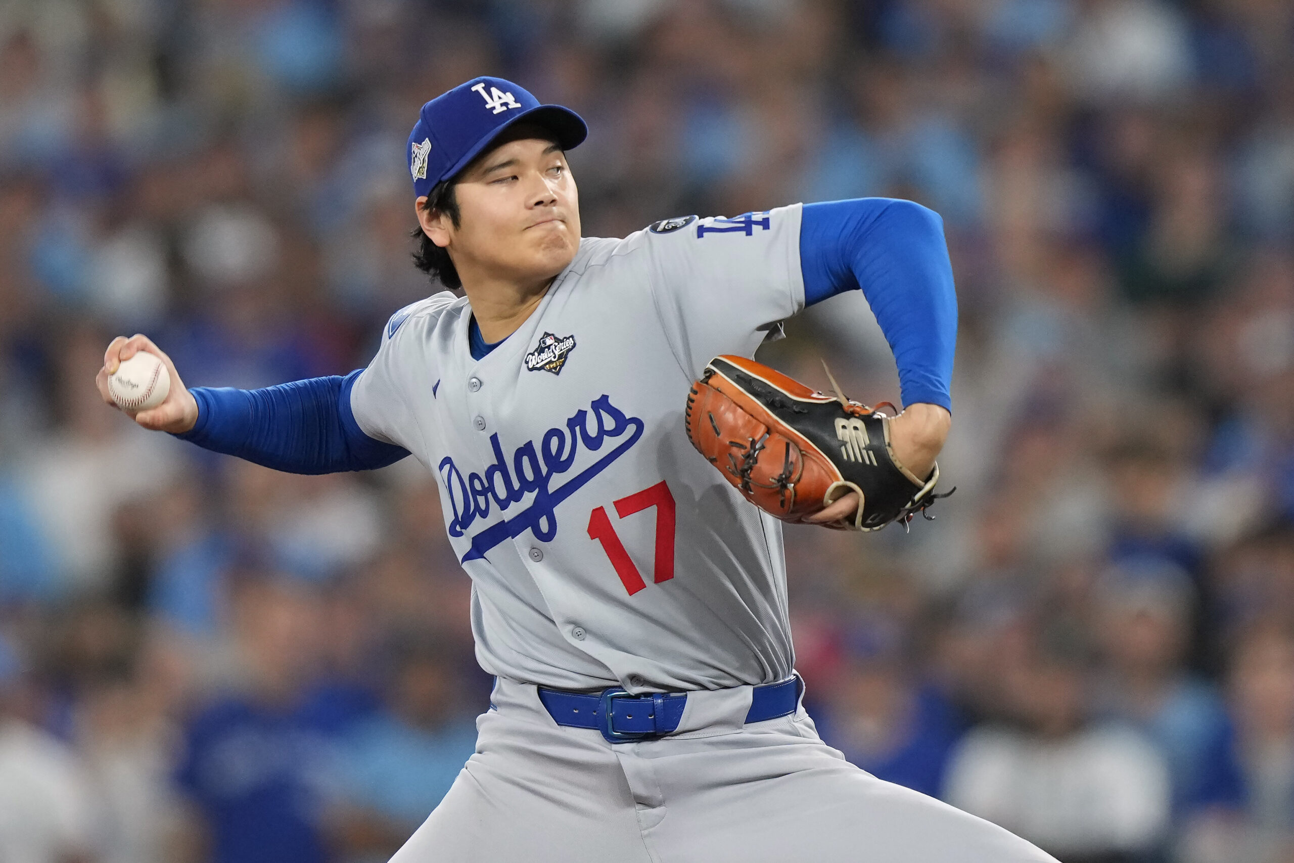 Dodgers starting pitcher Shohei Ohtani throws to the plate during...