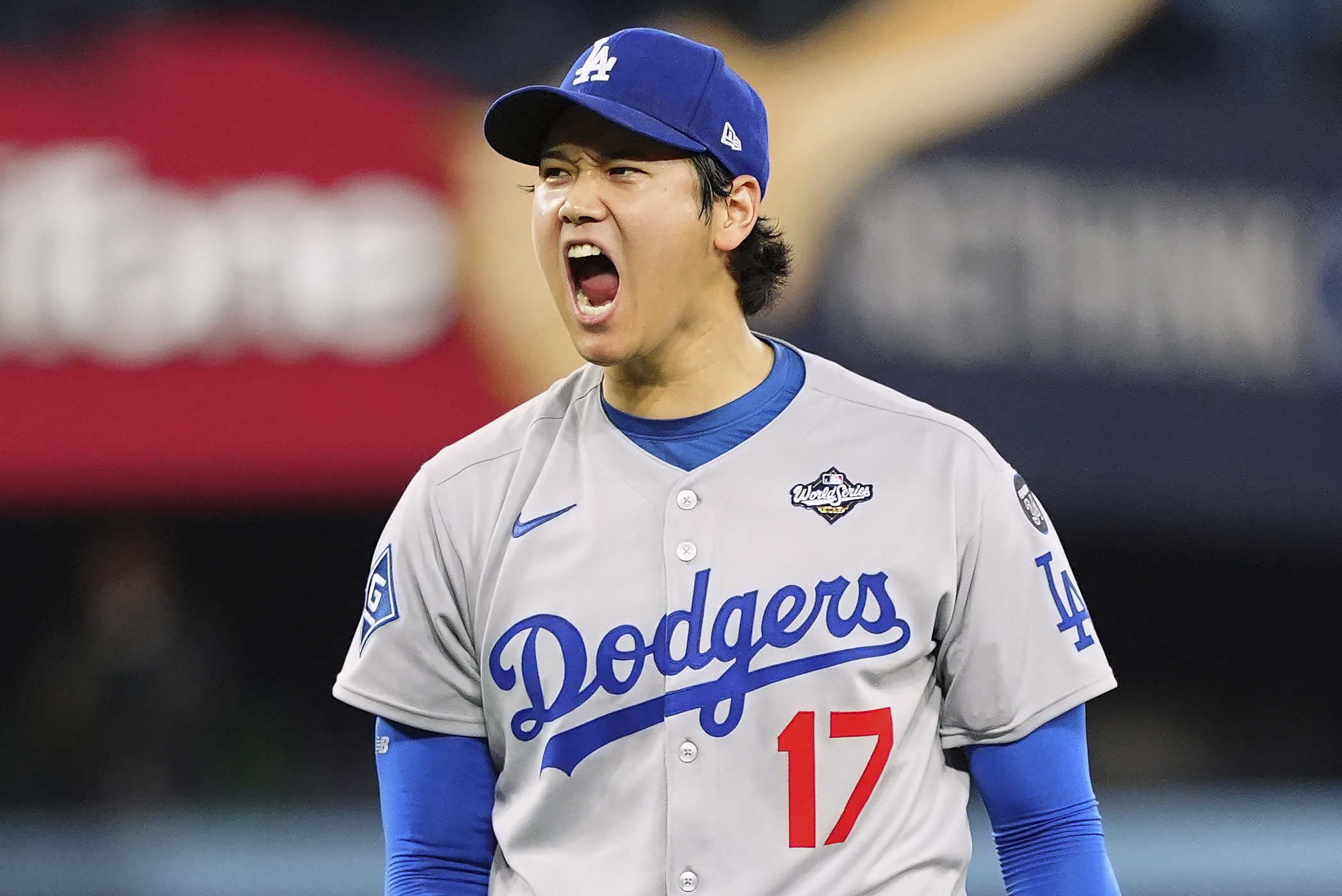 Dodgers starting pitcher Shohei Ohtani celebrates after striking out the...