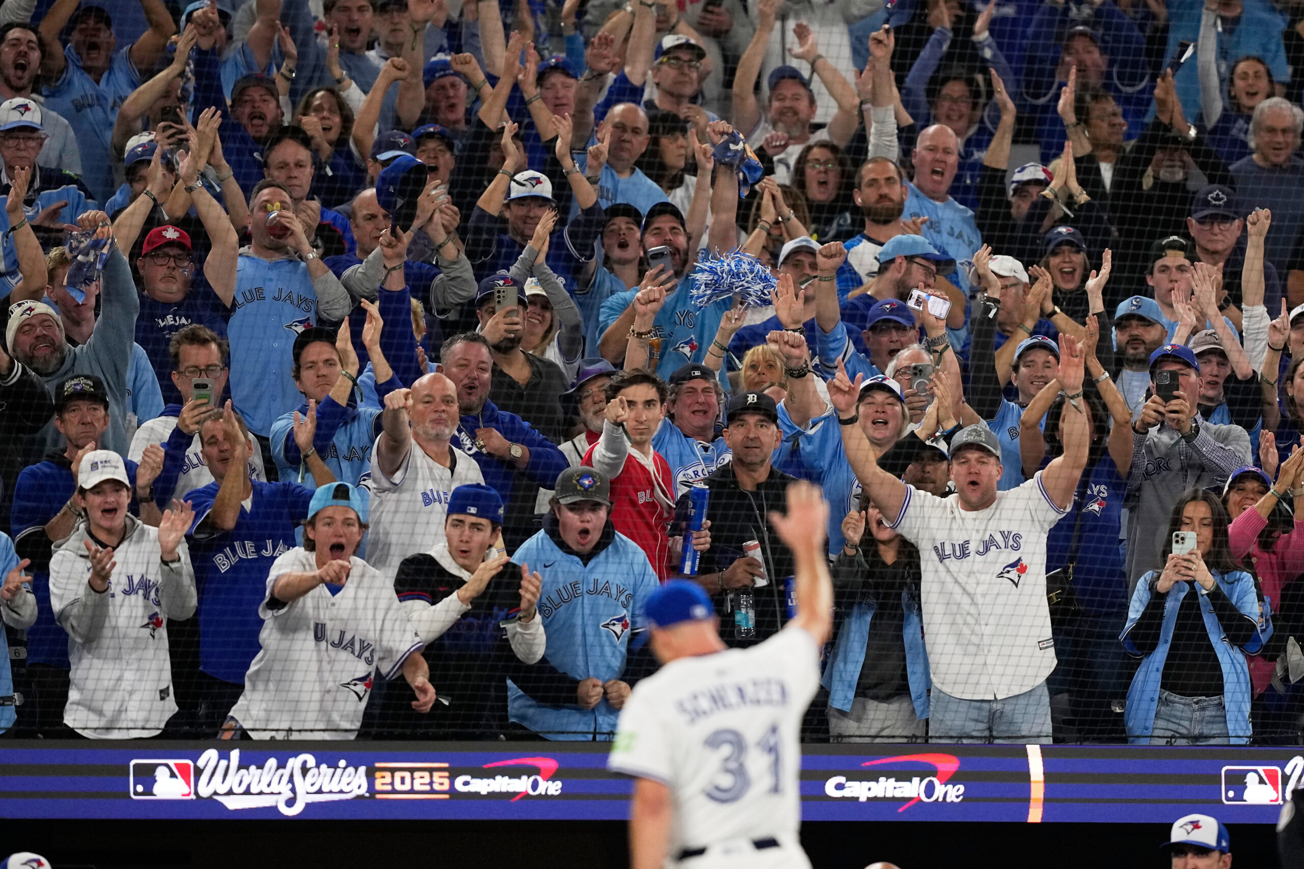 Fans react as Toronto Blue Jays starting pitcher Max Scherzer...