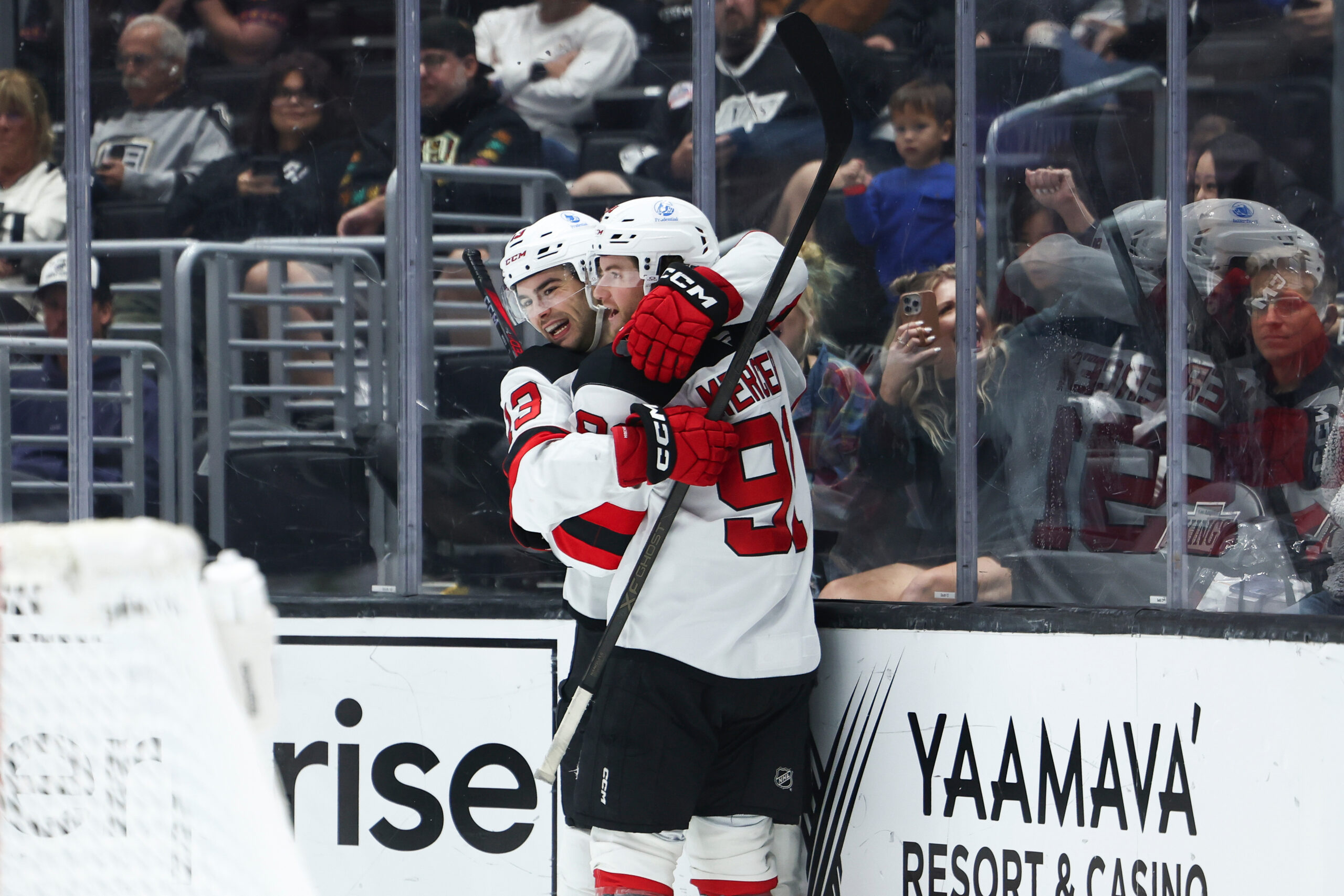 New Jersey Devils center Nico Hischier, left, and center Dawson...