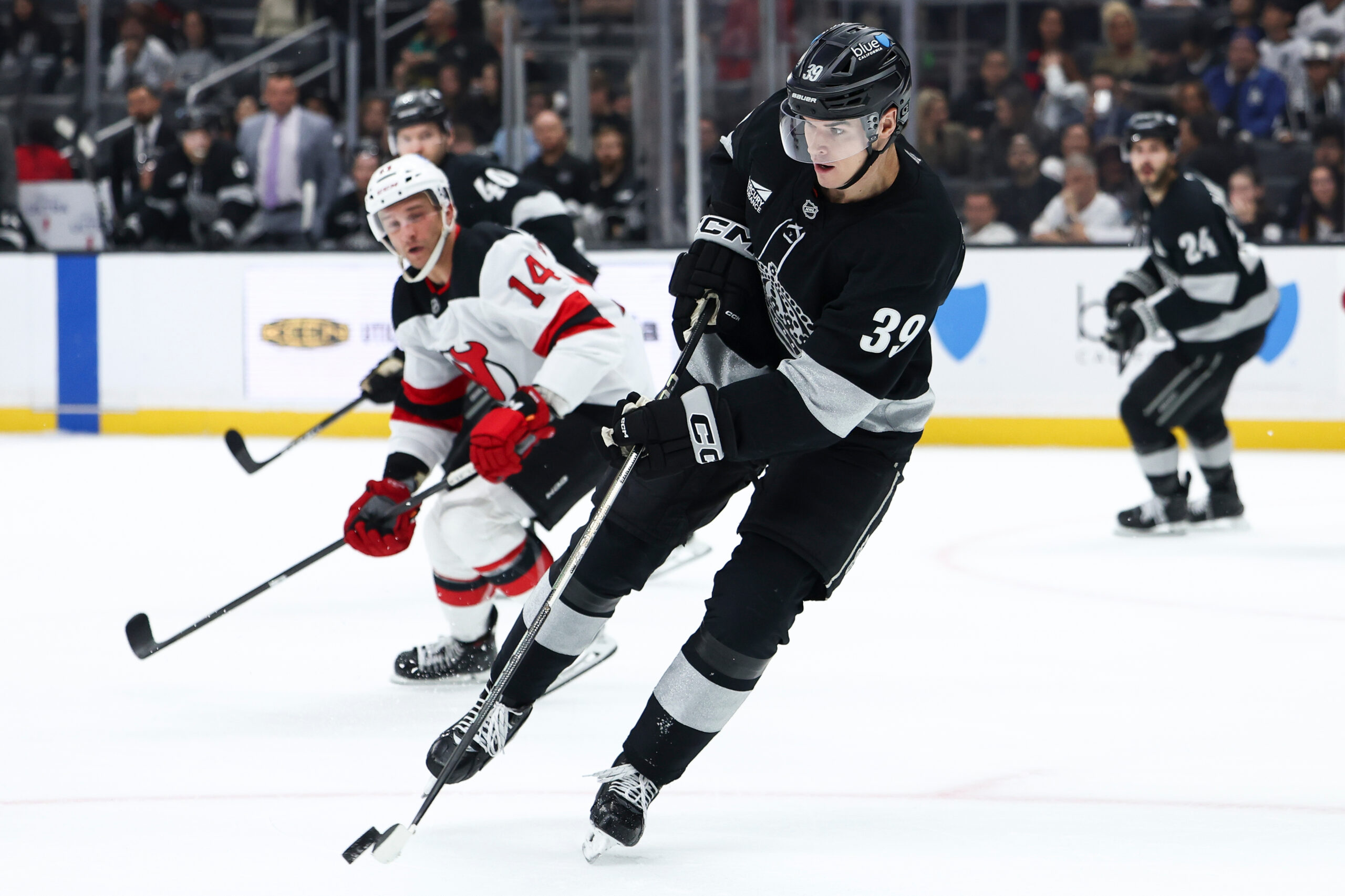 Kings left wing Jeff Malott (39) passes the puck as...