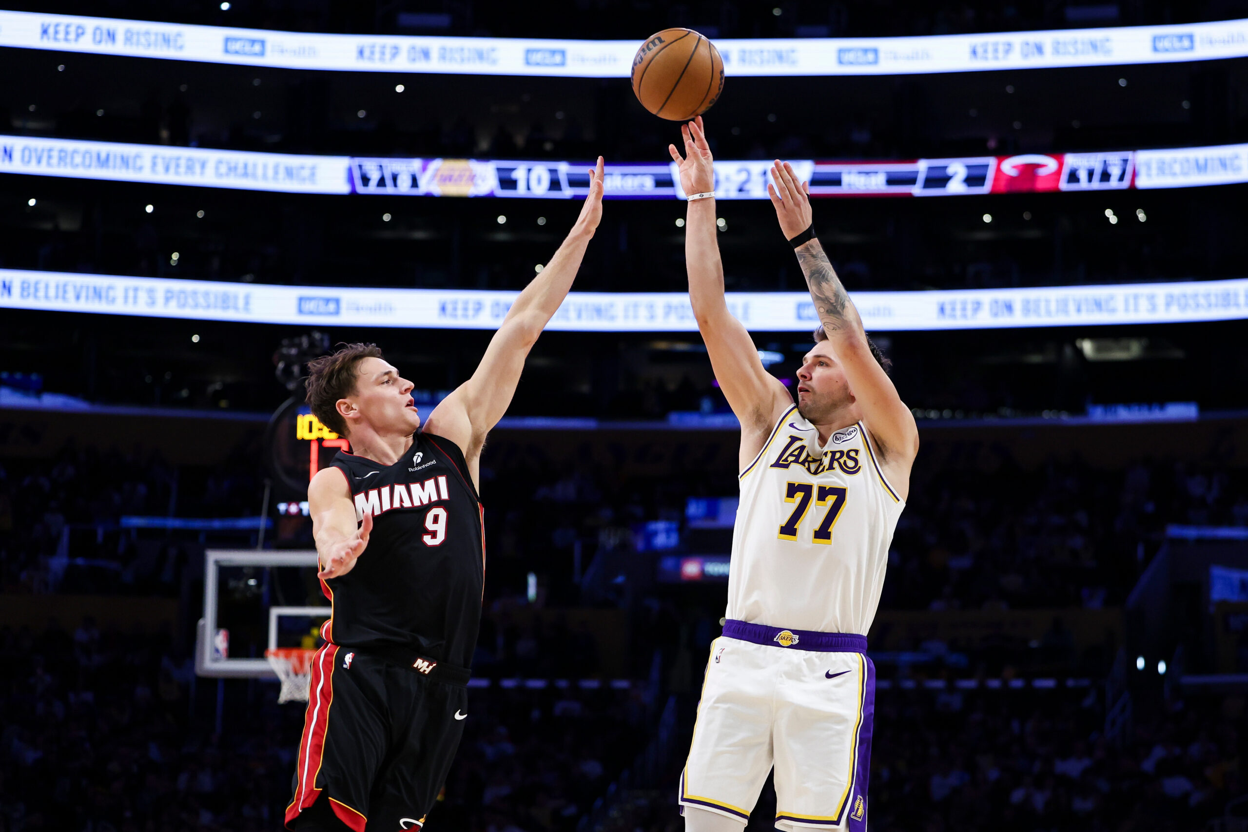 Lakers guard Luka Doncic (77) shoots against Miami Heat guard...
